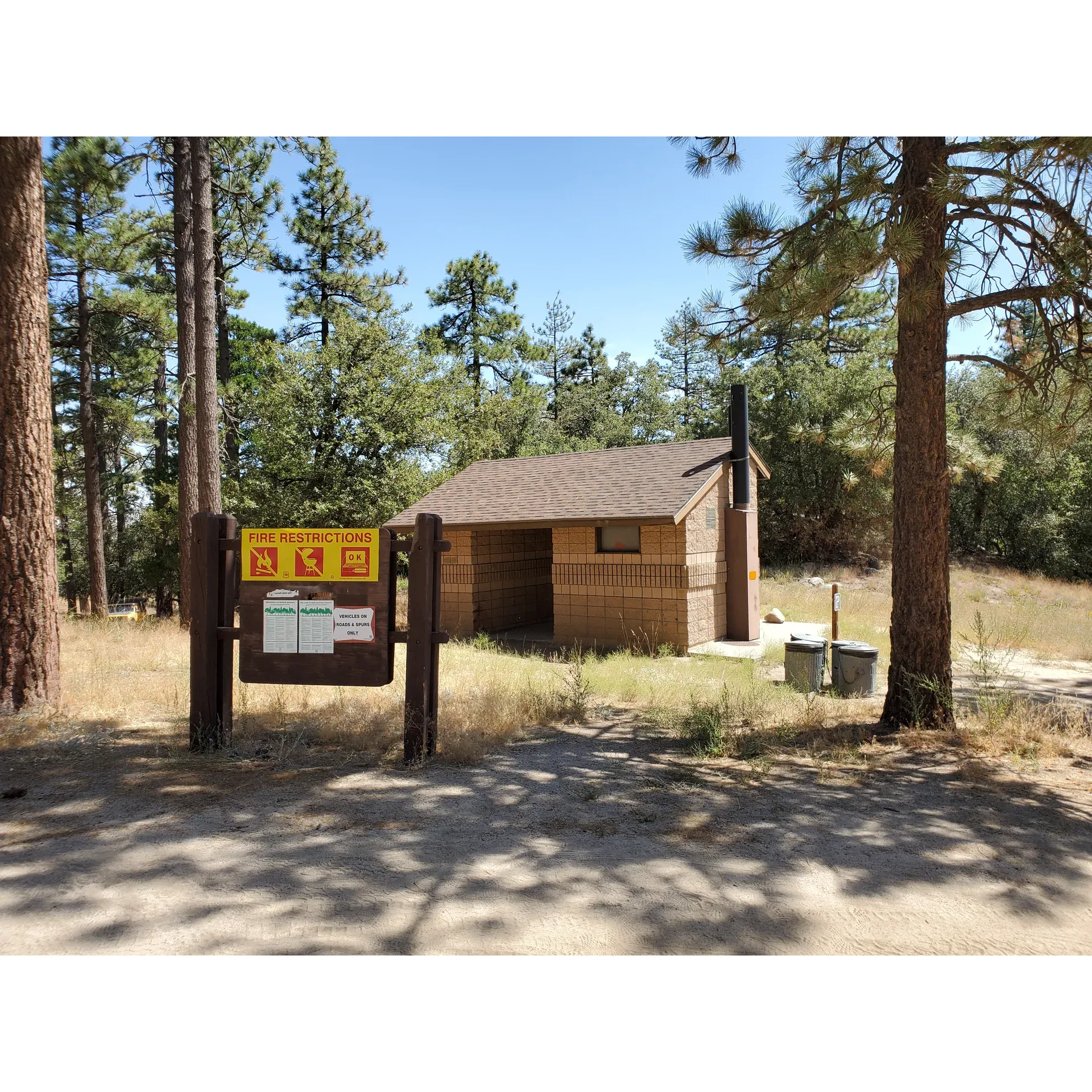 Embraced by the rugged charm of a winding dirt road, Tool Box Springs Yellow Post Sites offers an idyllic escape for nature lovers seeking tranquility and adventure. A mere four-mile drive on an accessible dirt road transports guests to a serene haven perfect for outdoor enthusiasts who yearn for simplicity and rustic beauty.

The site boasts well-stocked and maintained facilities, providing convenience with two bathrooms complete with essential supplies and outdoor trashcans to ensure a clean and comfortable stay. Across the four available campsites, visitors are greeted with practical amenities, including picnic tables and fire pits, elevating the camping experience and allowing for delightful outdoor dining and cozy evenings under the stars.

Two of the four sites boast generously larger areas, offering ample space for guests to spread out and relax. Embraced by the quietude of nature, the environment lends itself to a restful and rejuvenating retreat. Peaceful days blend seamlessly into tranquil nights, with luminous skies offering breathtaking stargazing opportunities.

For those inclined to exploration, the surrounding landscape provides a picturesque setting for off-roading adventures, where an array of vibrant wildflowers can be a delightful sight during certain seasons. In this idyllic outdoor setting, prepared guests can enjoy the wonders of nature while mitigating the presence of natural elements such as occasional flies and gnats with screened rooms or insect repellent.

Tool Box Springs Yellow Post Sites is a treasured getaway for visitors seeking peace, beauty, and an off-the-grid camping experience. Here, the spirit of nature whispers through the breeze, and the sweeping vistas invite endless discovery - a perfect backdrop for a memorable stay amidst the great outdoors. Description by ChatGPT.