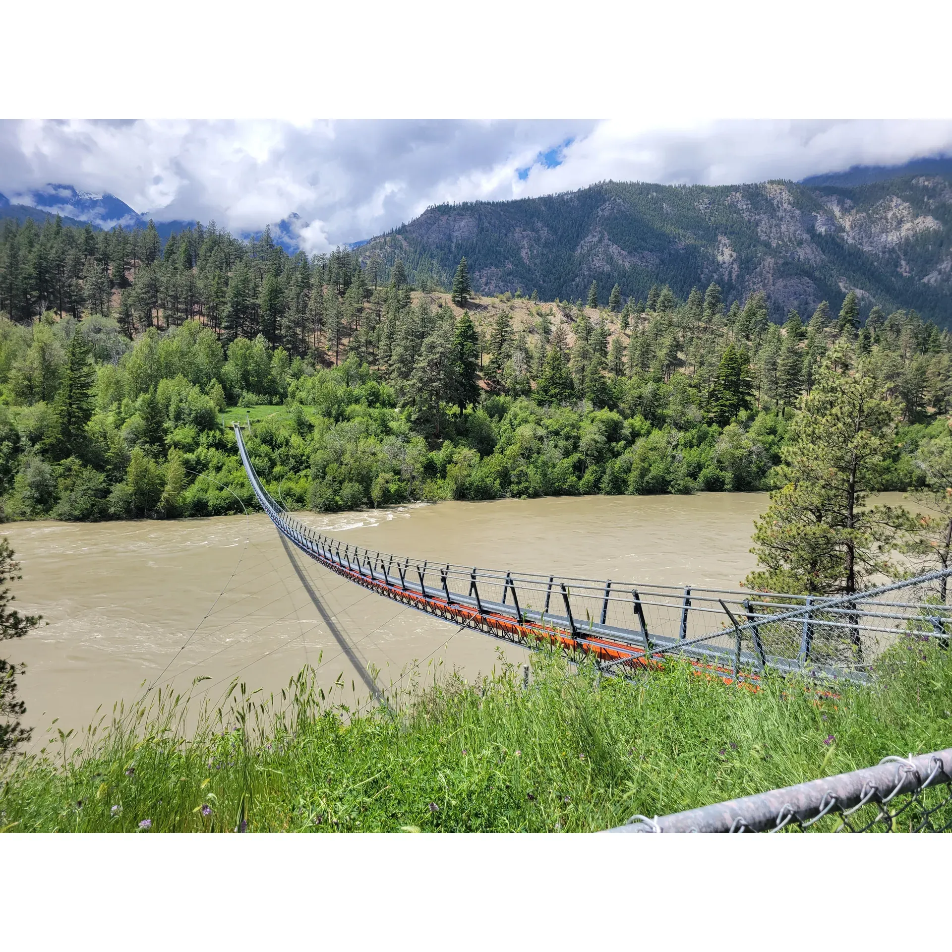 Embark on a breathtaking journey to the iconic Fraser River Suspension Bridges, where adventure seekers and nature enthusiasts unite for an immersive outdoor experience. This hidden gem is situated just a short 10-minute scenic drive from Lytton towards Lillooet, offering an exhilarating retreat for those who heed the call of the wild.

Begin your excursion by preparing for the day ahead—pack water to stay hydrated and embrace a mindset of reverence for the pristine surroundings you're about to witness. Upon reaching the well-marked location, conveniently located just beyond a recycling transfer station, you'll find a welcoming gate that heralds the start of your trek. Here, a safe pullout provides the perfect spot to park your vehicle before you venture onward.

Your 20-minute walk down the road to the suspension bridge is more than a mere stroll—it's a passage through time, gently guiding you through the exquisite landscape that serves as a testament to nature's grandeur. With each step, immerize yourself in the deep sense of tranquility that permeates the air, and keep to the road to ensure a safe journey, avoiding any chance encounters with the region's wildlife.

The culmination of your journey is nothing short of magnificent. As you step onto the structure, the rush of standing high above the roiling river below is an unparalleled experience. The bridge presents an awe-inspiring panorama that stretches as far as the eye can see, enveloping visitors in a vista of rugged beauty that captures the essence of British Columbia's untamed spirit.

Although the bridge is located on the sovereign land of the Lytton First Nation and is not open for unsanctioned public visits, the view from the surrounding area remains accessible for respectful adventurers to appreciate from a distance. While traversing the bridge itself is not an option, the journey to its vicinity and the surrounding landscape provide ample opportunities for photography, reflection, and connection with the natural world.

With each visit, we encourage a respectful approach to exploring this remarkable area, ensuring its beauty and integrity remain undisturbed for future generations. The Fraser River Suspension Bridge experience is more than a simple crossing; it is a respectful homage to the power and beauty of the natural landscape—an encounter you'll remember for years to come. Description by ChatGPT.