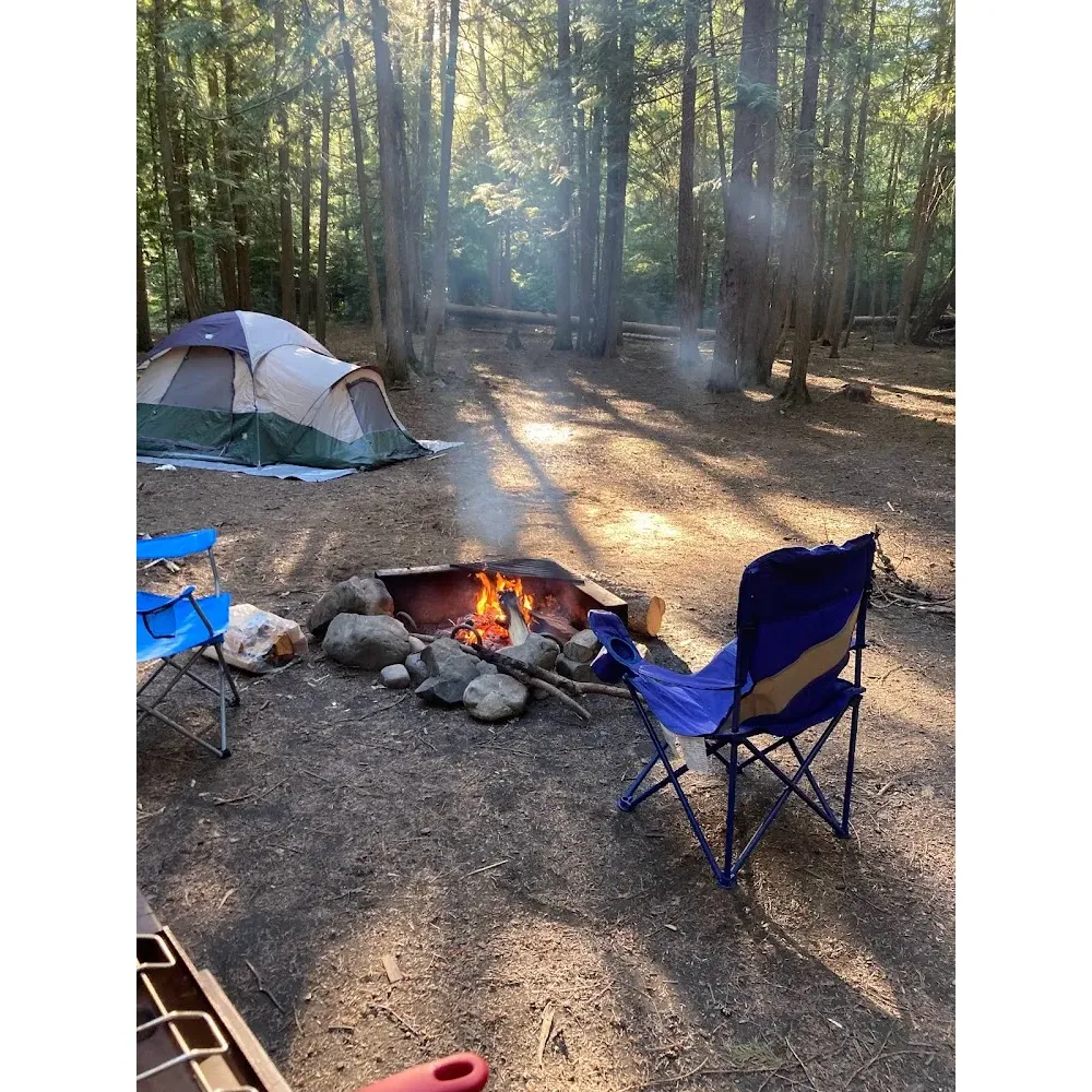 Hidden Lake Campground and Boat Launch is a stunning outdoor escape that offers an exceptional camping experience for nature enthusiasts and families alike. Visitors are encouraged to arrive early to secure their ideal campsite in this highly sought-after locale, where the beauty of the natural environment consistently exceeds expectations.

Boasting a pristine lake that captures the hearts of all who gaze upon its crystal-clear waters, this campground provides an idyllic setting for a variety of water activities, including boating, paddle boarding, and even shore diving from select lakeside campsites. Anglers and wildlife watchers will delight in the abundant fish population and the presence of local beavers, creating a serene and dynamic ecosystem to explore.

The facilities cater to guests' needs, with clean and abundant bathrooms equipped with hand sanitizers, ensuring a comfortable stay. For added convenience, free parking is available as well as free access to the boat launch, making water excursions hassle-free. Families will appreciate the added safety and cleanliness, as the campground features bear-proof dumpsters and pavilions for communal gatherings.

Affordability is a key aspect of Hidden Lake Campground, with an incredible overnight rate that provides budget-friendly accommodation without compromising on quality. Moreover, guests bearing an Access Pass may enjoy even further reduced rates, making it an unparalleled deal for an unforgettable outdoor adventure.

Enveloped in the scenic beauty of Kenai, the campground serves as a highlight for visitors to the area, with unique experiences such as the captivating calls of loons adding to the ambiance of this peaceful retreat. Whether seeking a tranquil haven or an adventure on the water, Hidden Lake Campground and Boat Launch is the perfect Alaskan summer getaway that promises fond memories and a desire to return. Description by ChatGPT.