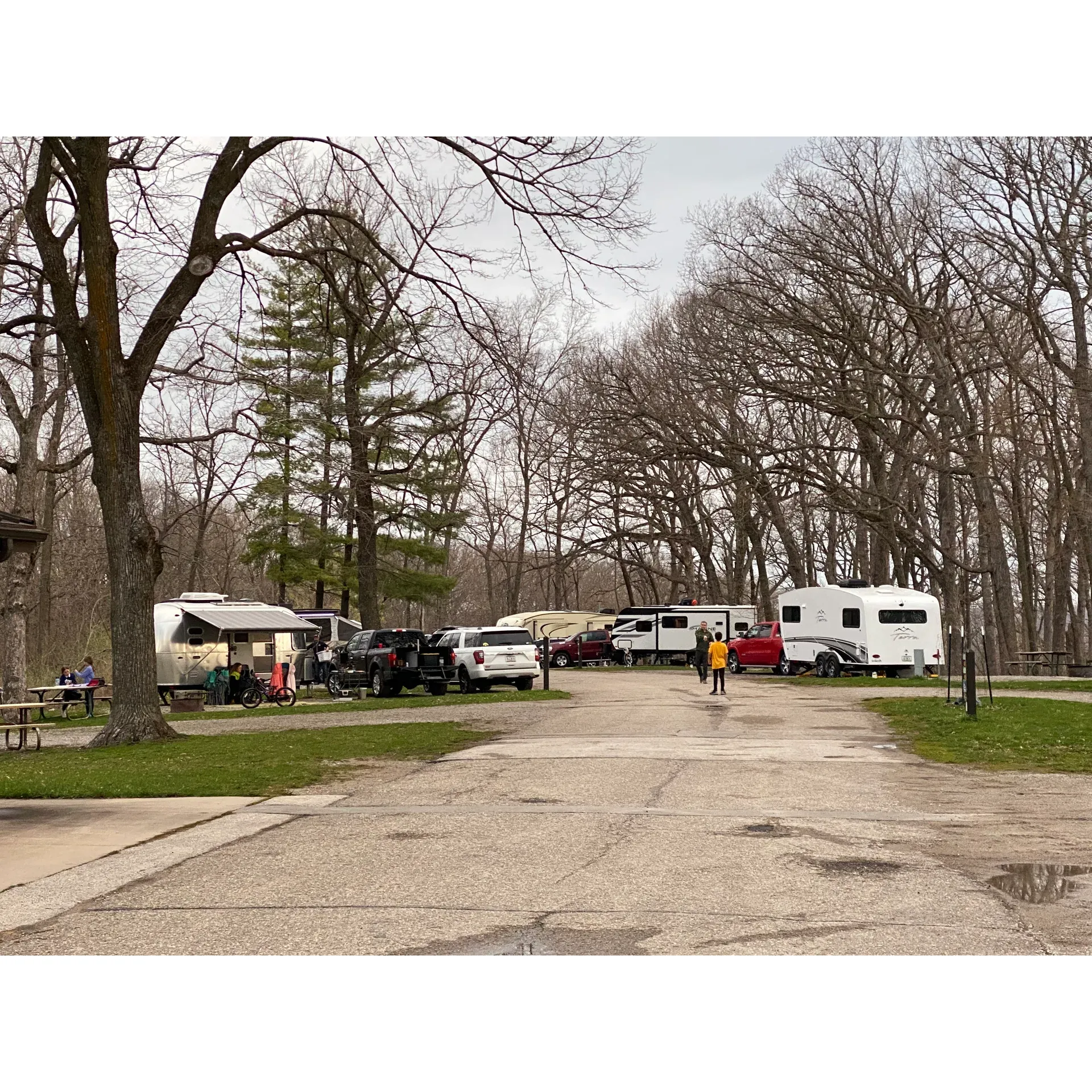 Lake MacBride North Modern Campground offers a serene getaway for outdoor enthusiasts looking to relish the beauty of a classic camping experience with added conveniences. Boasting a selection of well-maintained full hookup sites that accommodate RVs of various sizes, this campground ensures modern amenities are on hand to enhance your stay, including a centrally located bathroom and shower facility known for its cleanliness and maintenance.

Visitors admire the campground's tranquil atmosphere, with park rangers routinely tending to the grounds, which include cleanly mowed grass and regularly cleaned fire pits, fostering a tidy and welcoming environment. The level sites and smooth asphalt roads contribute to easy accessibility, although the charm of the traditional camping vibe remains intact.

Families treasure the array of recreational activities available, from kayaking, sailing, and swimming at the nearby beach to exploring the array of trails that wind through the surrounding landscape. The sites are offered on a first-come-first-serve basis, allowing for spontaneous adventures and a friendly, community-oriented feel. With proximity to a local town merely five miles away, essential supplies and additional amenities are conveniently within reach.

While there is no on-site camp store, the campground promotes the preparation of bringing your own supplies, including firewood which can be picked up on the journey to the site. As the campground harps on the joys of nature, guests are also inclined to take precautions against the local wildlife, adding an authentic touch to the rustic camping experience.

Love and nostalgia echo from visitors who have returned after many years to find a place that captures the essence of timeless nature retreats, now enhanced with full-service sites and facilities that cater to contemporary needs while respecting the minimalist ethos of classic camping. Lake MacBraid North Modern Campground remains beloved for its uncomplicated charm, impressive upkeep, and the joy it continues to bring to families and camping aficionados alike. Description by ChatGPT.