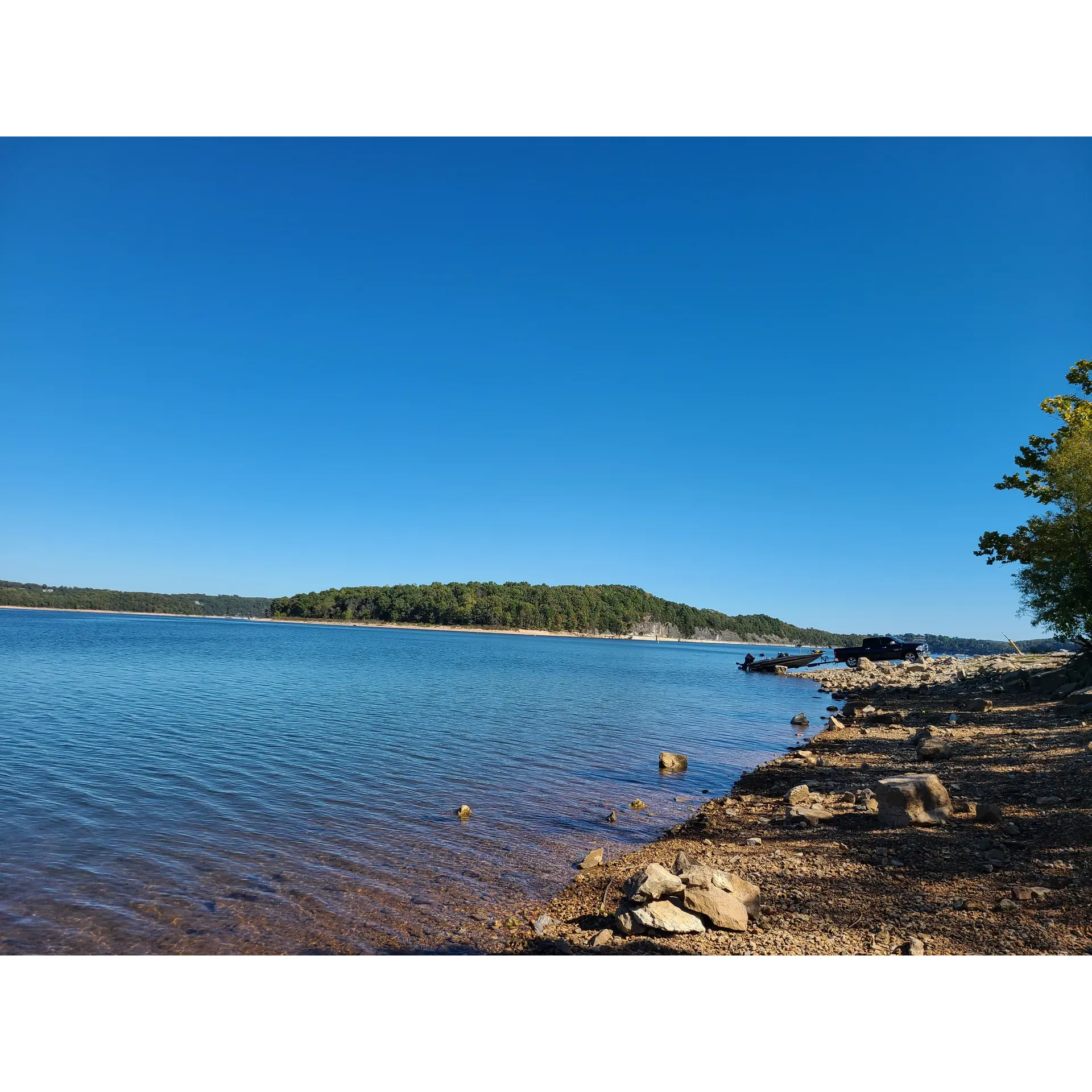 Beaver Lake, with its sprawling beauty and crystal-clear waters, emerges as a premier destination for both locals and travelers looking for a tranquil escape or an adventurous outing. Favored for its capacity to comfortably accommodate large gatherings, it's a delightful spot for grand picnics, enjoyable barbecues, and engaging outdoor games.

Visitors often rave about the spectacular sunsets that cast a warm glow over gatherings, creating an ambiance that's both captivating and soothing. The sense of enchantment is further heightened for those who have emotional ties to the area, recounting childhood memories of swimming in the lake's inviting waters, occasionally revealing historical glimpses of a submerged town and church.

The surrounding landscape, characterized by beautiful bluffs, provides a picturesque setting that captures the essence of the region. Guests can indulge in the serenity of the area and take in fantastic views that offer a romantic backdrop, perfect for moments of reflection or a peaceful retreat.

The lake is well-maintained and prides itself on being both clean and sparsely populated, offering a sense of seclusion without isolation. Visitors speak highly of the friendly locals and the inviting atmosphere they create, enhancing the overall experience.

For those seeking aquatic adventures, boating becomes a quintessential part of the Beaver Lake experience, with the Lost Bridge Marina providing essential services despite the contrasting levels of hospitality. Meanwhile, the challenging terrain leading from rental homes to the lake ensures a rewarding sense of accomplishment for those navigating the steep, rocky slopes.

Moreover, the scenic drive through the mountains to reach Beaver Lake is an experience in itself, setting the stage for the beauty that awaits. Basking in this natural paradise, visitors from afar, including those from overseas, can witness the charm and allure that make this destination a jewel of Arkansas.

Ideal for nature lovers, families, and adventurers alike, Beaver Lake calls out to those in search of solace, scenic beauty, and a touch of nostalgia—all wrapped up in a picturesque lakeside sanctuary. Whether it's for enjoying a slice of serenity or creating new memories, this lake is a haven that beckons one to return time and again. Description by ChatGPT.