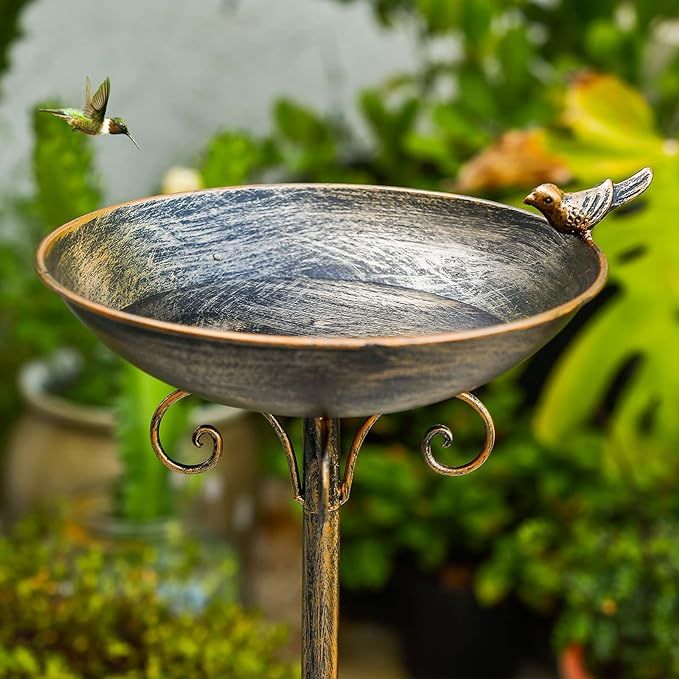 The 11.4" W*27.6" H Cast Iron Pedestal Bird Bath is a vintage style outdoor decoration that can serve as a bird feeder, drinker plate, or simply as a decorative piece for your home garden, lawn, or yard. Made of durable cast iron, this pedestal bird bath is stable and long-lasting, making it suitable for outdoor use.
With its height of 27.