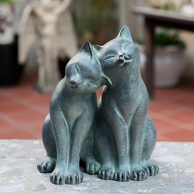 Add some whimsical charm to your home or garden with this adorable sculpture of two playful kitten friends. The antique bronze and verdigris finish gives the piece a vintage look, while the hand-painted detailing adds a touch of artistry.