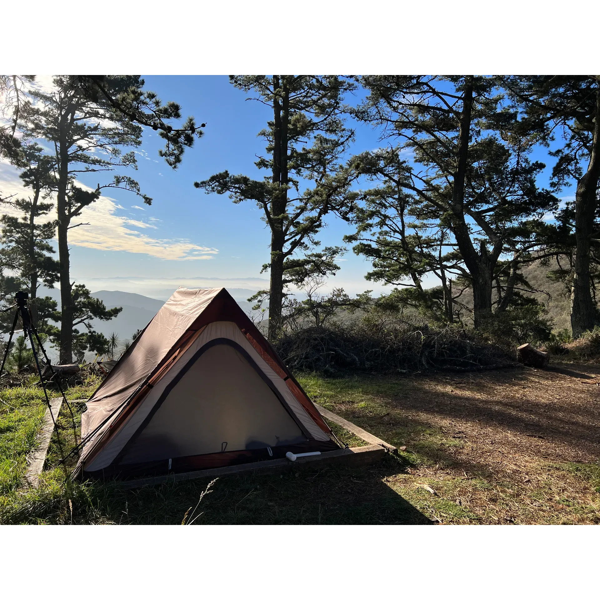 Hawk Campground is a serene retreat that offers intrepid campers the opportunity to immerse themselves in the great outdoors while enjoying stunning panoramic views. Perched at a vantage point that rewards visitors with picturesque landscapes on clear days, the campground caters to those seeking a tranquil escape, with a modest provision of amenities that accentuate the surrounding natural beauty.

For those ready to take on a moderate challenge, the hike to the campground serves as a prelude to the escapade, featuring an uphill journey that promises to invigorate the spirit and stimulate the senses. The seclusion of the campground provides a sense of peace and privacy, with a mere three campsites available, making it a coveted spot for those who secure a reservation. Each campsite is equipped with a level terraced area for tents, ensuring a comfortable night's sleep under the stars, as well as a picnic table for outdoor dining amidst the elements and a secure bear box to keep provisions safe.

Notably appreciated by guests is the presence of a well-maintained portable bathroom facility, which stands as an unexpected convenience in such a rustic setting. The campground also boasts reliable cellular reception for select carriers, allowing campers to remain connected, if they choose, to the outside world.

Conscious of the landscape's undisturbed beauty, visitors are charmed by the enveloping fog on misty mornings, lending an ethereal quality to the environment that must be experienced to be truly appreciated. Cyclists find the nearby biking trails to be an exhilarating bonus, with routes that challenge and reward in equal measure.

Hawk Campground stands out as a haven for those who appreciate the harmony of nature, stunning vistas on sunlit days, and the simple joys of an outdoor adventure. It calls to those eager to trade the hustle and bustle of daily life for the soulful solitude and majesty of the natural world. Description by ChatGPT.