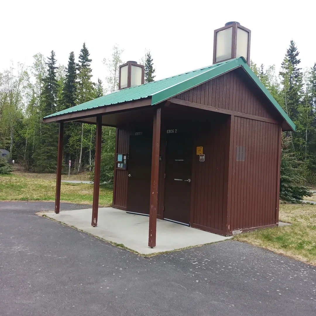 Experience the charm of the Alaskan great outdoors at Eagle River Campground, a serene and scenic retreat ideal for campers and nature lovers alike. Located within a stone's throw of Anchorage, this destination offers effortless convenience without sacrificing the beauty and tranquility of a wilderness escape. Eagle River Campground welcomes guests with well-maintained sites that cater to tents, RVs, and trailers—each complete with a picnic table and fire ring, allowing you to dine al fresco or cozy up by a warm fire.

As you explore the grounds, you'll find the facilities thoughtfully designed with campers' needs in mind. This includes cleanly kept restrooms, potable water stations for your hydration needs, as well as ADA-accessible options to ensure inclusiveness for all adventurers. Although currently without an RV dump station, the amenities provided ensure a comfortable stay for most.

The natural landscape surrounding Eagle River Campground captures the hearts of its visitors, showcasing Alaska's raw beauty with every turn. Families and individuals can revel in the quietude and welcoming atmosphere that permeates the campground, fostering relaxation and connection with the environment.

Revel in the nearby Eagle River, where you can enjoy a pleasant stroll and take in the sights and sounds of flowing water, all while being just a short drive from local shopping and dining options. The proximity to these conveniences adds to the appeal, granting you the benefits of both nature's wonders and urban amenities.

Pet owners can take joy in bringing their furry companions along for the adventure, as the campground is dog-friendly, ensuring your beloved pets can join in on the fun while keeping them securely leashed.

Overall, Eagle River Campground presents an excellent balance for those wishing to bask in nature's splendor while appreciating modern comforts and accessibility. It's an inviting retreat that offers an authentic Alaskan wilderness experience without venturing too far from home comforts. Description by ChatGPT.