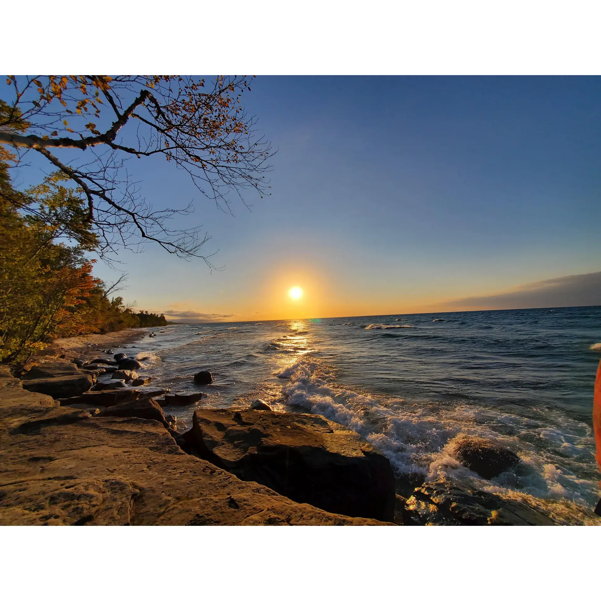 Hurricane River Campground offers an exceptional outdoor experience, where the tranquil sounds of Lake Superior's waves provide a soothing backdrop for restful nights. Enthusiastic campers can choose from a variety of campsites, each offering its own unique proximity to the majestic lake, with some being mere yards away, providing direct access to stunning shoreline vistas. Guests are treated to breathtaking sunsets and sunrises, painting memories that last a lifetime.

Adventurers and nature lovers can embark on a scenic hike to the historical Au Sable Lighthouse, where they are greeted not only by the charm of the preserved buildings but also by captivating views of the lake and intriguing glimpses into the past with visible shipwreck remains. With the campground serving as a gateway, the well-maintained trail leading to the Light Station promises an easy and enjoyable 1.5-mile walk, accessible for all levels of hikers.

The Hurricane River itself offers a playful escape where children and adults alike can revel in the water's gentle flow. Campers seeking contemplation or a touch of adventure can explore numerous trails, be enchanted by the inviting beach, and relish the tranquility ensured by the campground's enforced quiet hours.

The overall layout of the campground provides a balance of seclusion and community, with well-spaced sites allowing for privacy, while still fostering a friendly atmosphere. Whether staying at the upper campsites, which grant a sense of retreat, or at the lower sites, where the lake's presence is ever-present, visitors enjoy the convenience of amenities and the simplicity of nature's offerings.

For those making spontaneous travel decisions, Hurricane River Campground is a delightful surprise, effortlessly blending accessibility to natural wonders like the Au Sable Lighthouse trail and Log Slide lookout, with the serenity of a beachside retreat. It's a place where the harmony of the outdoors elevates camping to an experience of pure joy and relaxation. Description by ChatGPT.