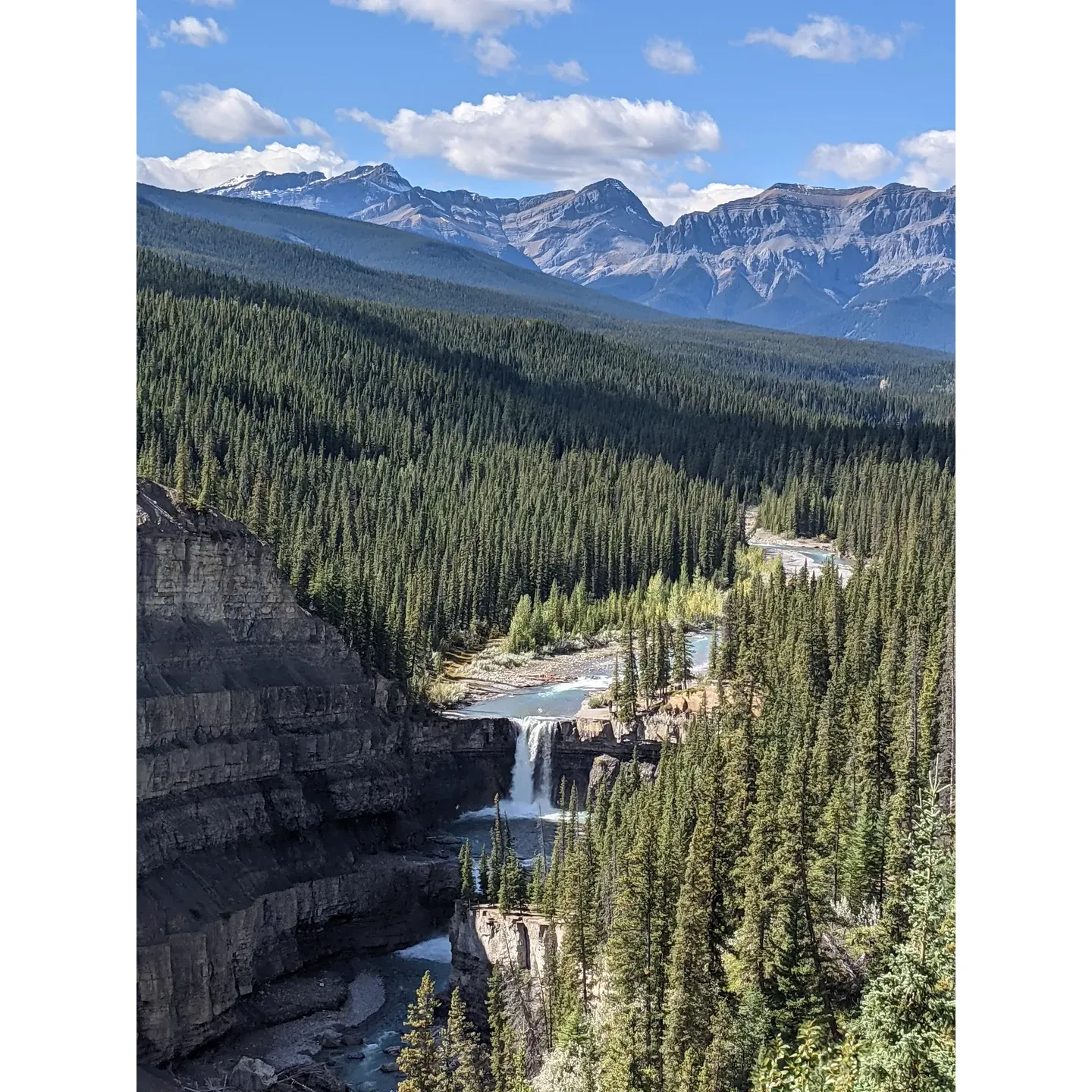 Experience the breathtaking beauty of Crescent Falls, a remarkable gem set within the pristine Crescent Falls recreation area. This dual waterfall destination is a haven for outdoor enthusiasts, offering an array of exhilarating activities, including camping under the stars, casting a line in the hopes of a fresh catch, traversing scenic hiking trails, and embarking on horseback adventures through diverse landscapes.

Upon your arrival, a short and invigorating 20-minute walk awaits, guiding visitors through patches of variable terrain—reminder that sturdy footwear is essential. Convenient facilities are situated at the trailhead, ensuring comfort before the journey to the majestic falls. 

As you emerge at your destination, prepare to be captivated by the sheer splendor of the falls. The viewing experience is enriched with strategically placed paths and gravel access roads. These trails offer multiple perspectives to witness the falls' grandeur, as they cascade powerfully into the riverbed below.

For those seeking a more immersive experience, the trail between the first lookout and the falls itself is nothing short of magnificent. Trek through tranquil woods and be rewarded with stunning vistas of the expansive river canyon, with winding paths suitable for both foot travel and mountain biking. This trail adventure is also a delight for canine companions.

Venturing just a few kilometers from highway 11 in Alberta, Canada, dedicated explorers are treated to a visual feast. The effort to descend to the riverbed pays dividends as the view fronting the plunging waters is spectacularly unforgettable. Peer over the edge from the main viewing deck, and the sense of scale becomes evident, with the falls dropping dramatically below.

In anticipation of further enhancing the natural allure of Crescent Falls, upgrades are underway to ensure an even more satisfying visit when it reopens in June 2024. Prepare yourself for an unforgettable visit where nature's artistry is on full display, offering a transcendent escape to all who seek the unparalleled beauty of this Canadian natural wonder. Description by ChatGPT.