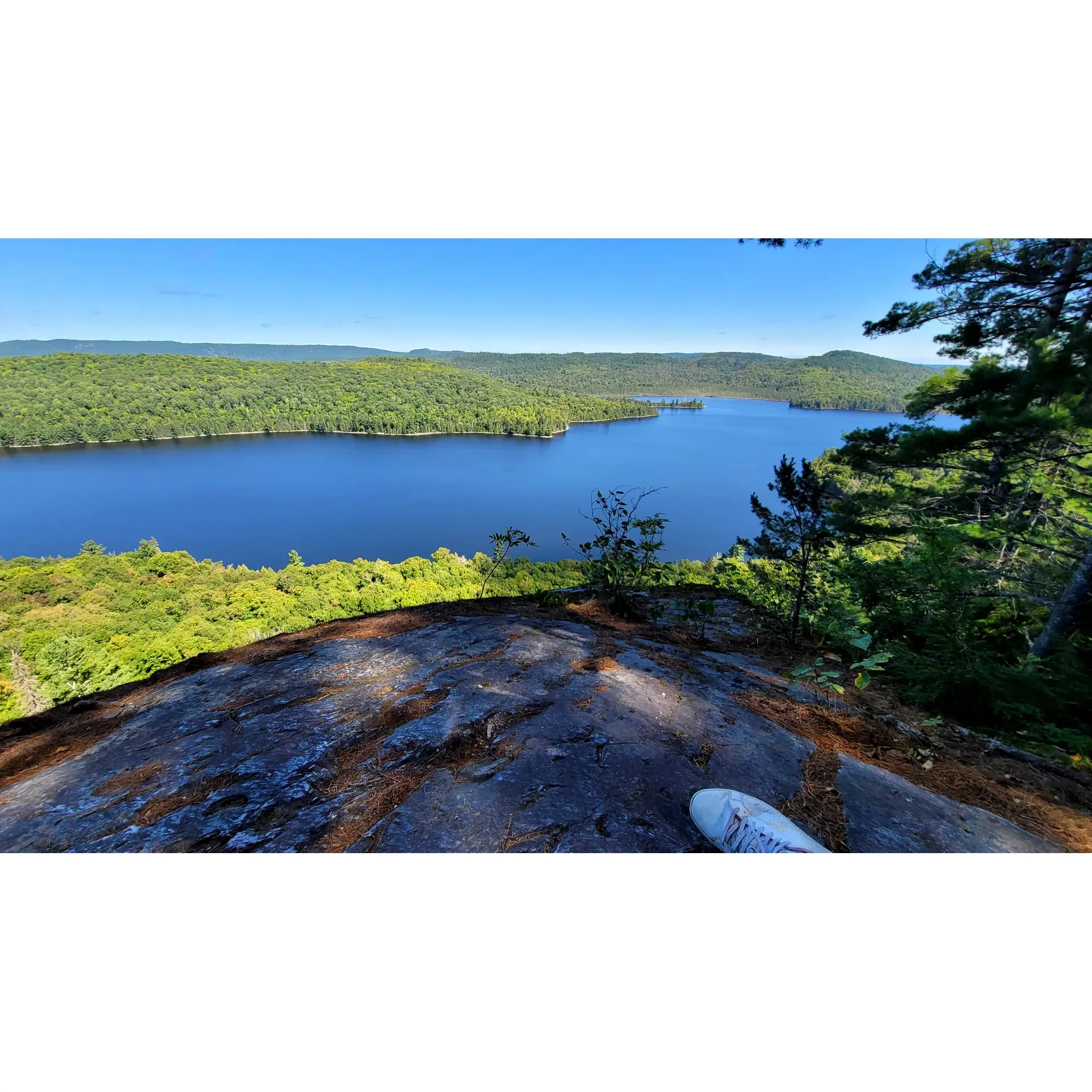 Mississagi Provincial Park is a serene escape into the great outdoors, offering visitors a stunning canvas of natural beauty and tranquility. Celebrating love in the wild, the park is a favored stop for newlyweds and adventurers alike, providing unforgettable hiking experiences through diverse landscapes. The panoramic views from the Helenbar Lake lookout will fill your memories with picturesque scenes, making each moment spent an enchanting encounter with nature's splendor.

Campers revel in the spacious and beautifully forested sites, noting their privacy and proximity to the clear, inviting waters. In the embrace of the park’s quietude, the sounds of wildlife are the perfect backdrop to a peaceful retreat. Early summer visitors find a special solace with nearly empty grounds, adding to the park's feeling of seclusion and intimacy.

The array of hiking trails, including the admired Helenbar Lake and Flack trails, cater to various skill levels, each winding through the park's rich ecosystems and offering their own unique experiences. The crystal-clear lake not only invites for contemplative moments but also beckons outdoor enthusiasts for a refreshing dip.

While up-close encounters with nature are the essence of the park, amenities such as clean outhouses ensure a comfortable stay, reflecting the park's commitment to maintaining a harmonious balance between wilderness adventure and visitor needs. The canopy of stars that unfurls above each night is a celestial spectacle, enhancing the immersive outdoor experience.

Providing not just a getaway but an opportunity for discovery, Mississagi Provincial Park is recognized as a precious hidden gem in a city ripe for exploration. Its well-kept lands and clear waters have captured the hearts of many, inviting a promise of return to this sanctuary of natural beauty. With canoe rentals on offer, the park encourages guests to glide along its glassy waters, creating ripples of joy and adventure in the tranquil expanse. Whether seeking solitude or shared moments, Mississagi Provincial Park embodies a purist's approach to wilderness camping and a celebration of the untamed world. Description by ChatGPT.