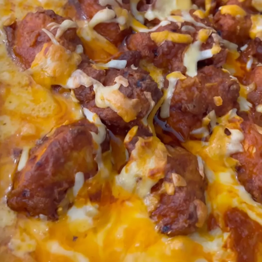Buffalo Chicken Bites bring a spicy tang to your kitchen, with chicken pieces marinated, perfectly fried to golden crispness, and drizzled with tangy buffalo sauce. These mouthwatering bites promise to be an irresistible crowd-pleaser.