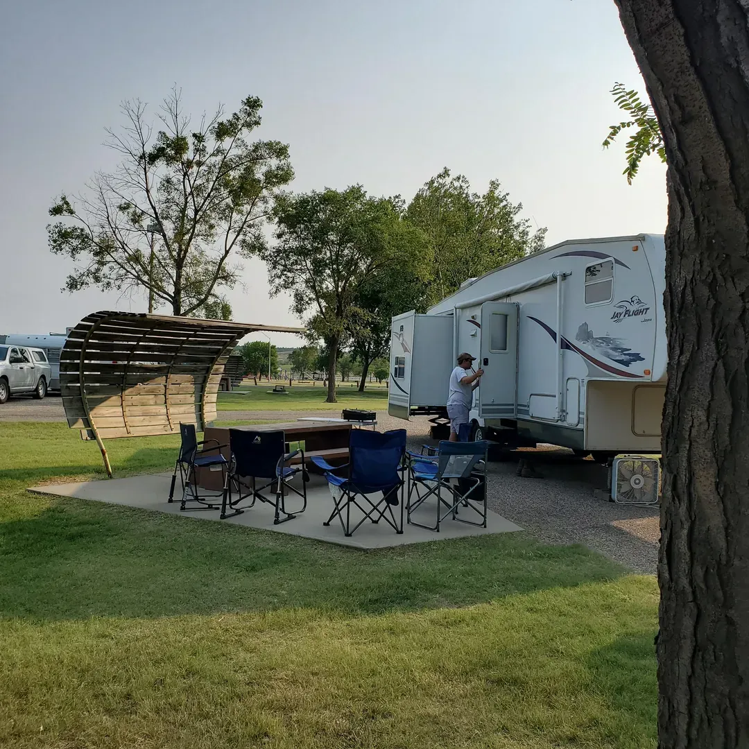 Left Tailrace Campground offers an idyllic retreat for travelers looking to enjoy the great outdoors with a touch of comfort and convenience. This highly-regarded campground is renowned for its exceptional cleanliness and the attentive care provided by the hospitable hosts. The campground boasts modern amenities, including regularly maintained bathroom facilities equipped with showers, ensuring a pleasant stay for all guests.

Visitors have various options for accommodation, including sites like 21b, which offers a spectacular view of the lake, and 19b, which has a smaller but still appreciable lake view, enhancing the camping experience with picturesque surroundings.

Guests will find the campsites well-equipped, with sturdy concrete tables, comfortable benches, and reliable electrical power at each site. For added convenience, water access is readily available throughout the campground. Boat enthusiasts will appreciate the expansive boat launch, facilitating an easy entry to water-based activities.

Left Tailrace Campground is also a haven for technology users, with full Verizon and Dish satellite service available, making it easy for campers to stay connected and entertained. For those who enjoy exploring on foot, the paved level sites are complemented by easily navigable areas perfect for leisurely strolls.

In addition to offering attractive prices, especially for senior visitors, the campground is positioned in close proximity to essential amenities. A small Dakota Mart located a few miles away in Fort Thompson provides guests with most of the necessities, including live bait for fishing enthusiasts.

The serene atmosphere of this electric-only campground is further enhanced by the availability of spacious back-in and pull-through sites and the tranquil ambiance. With its friendly camp staff, premium fishing opportunities, notably catching walleye, and its close-knit community feel, Left Tailrace Campground stands out as a destination that warrants strong recommendations for those seeking a rejuvenating escape with the comforts of home. Description by ChatGPT.