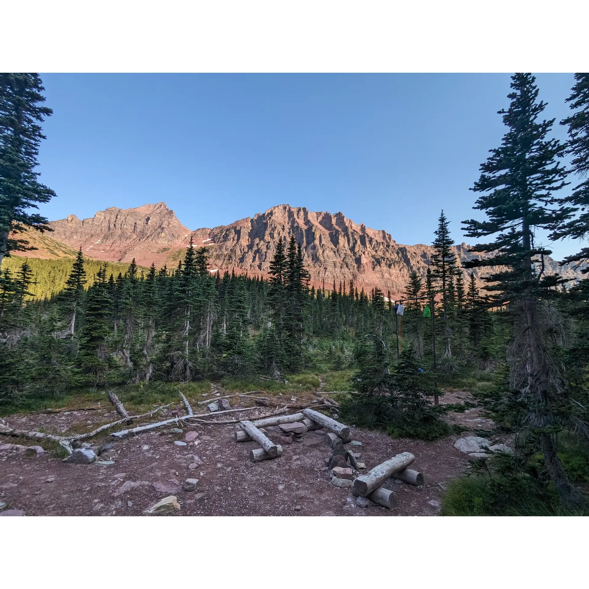 Cobalt Lake Campground offers a breathtaking outdoor experience for avid adventurers and nature lovers. Accessible via a 10-mile hike teeming with the raw beauty of unspoiled wilderness, the campground presents an invigorating challenge that rewards trekkers with a tranquil setting at journey's end. As you emerge into the campsite, you’re greeted by the awe-inspiring Cobalt Lake, its crystalline waters mirroring the surrounding peaks and making a perfect backdrop for an idyllic retreat.

The landscape around the campground is a painterly array of mountains and streams. Hikers can enjoy a day hike around the area, taking in the spectacular vistas and soaking up the serene atmosphere. The crystal-clear lake, though brisk, adds to the invigorating quality of this high-altitude haven, ensuring that a dip, though refreshing, is a memorable experience.

For added convenience and wildlife management, the campground is equipped with food poles, offering campers a practical solution to store provisions securely and maintain the delicate balance of the natural habitat. With these thoughtful facilities, guests can comfortably focus on the splendor of their surroundings, making their stay at Cobalt Lake Campground an unparalleled adventure in the wilderness. Description by ChatGPT.