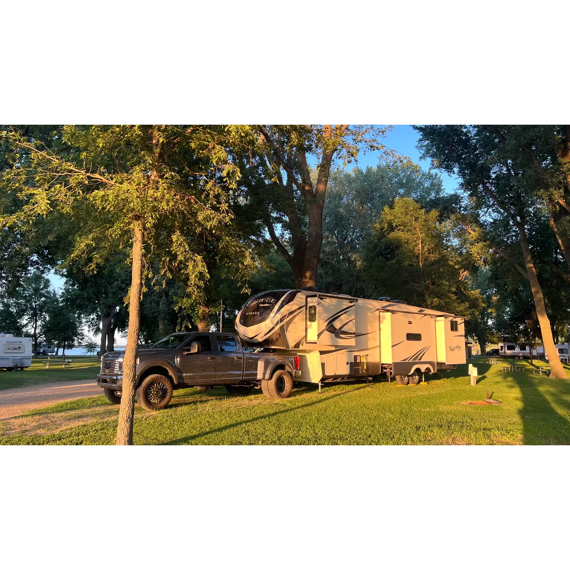 Olson Campground in Worthington is a delightful outdoor retreat offering guests an idyllical lakeside experience encompassed by the serenity of mature trees providing ample shade. The well-maintained campsites present a tranquil setting, with the majority offering the convenience of 50 amp service and accessibility to water spigots and a dedicated dump station to ensure a seamless camping adventure. 

Cleanliness and comfort are paramount, with immaculate bathroom facilities that include hot showers, allowing for a refreshing end to a day spent exploring the natural surroundings. Guests are greeted with warmth and friendliness by the helpful staff, keen on offering insightful advice to enhance the camping sojourn. 

The campground is praised for its beautiful locales, particularly the picturesque lake view spots. Adventurous souls can undertake a relaxing 8km stroll around the lake, a journey made comfortable by the flat terrain and generous shade, making it a recommended activity for nature lovers. 

Family-friendly amenities such as a playground and a pavilion contribute to making Olson Campground a wonderful choice for all ages. The nearby bike and walk trails invite visitors to immerse themselves in the charm of the city's parks. As a pet-friendly establishment, it also welcomes four-legged companions to enjoy the outdoor space.

The surrounding city of Worthington complements the camping experience with its neatly manicured lawns, attractive gardens, and nearby shopping conveniences, presenting an overall picture of a well-tended community.

Olson Campground epitomizes the essence of a beautiful, peaceful, and well-equipped establishment, offering an enjoyable stay at a good value any time of the year. Whether in the lushness of summer or the quiet beauty of a snowy winter day, it provides a magical escape for travelers and campers alike. Description by ChatGPT.