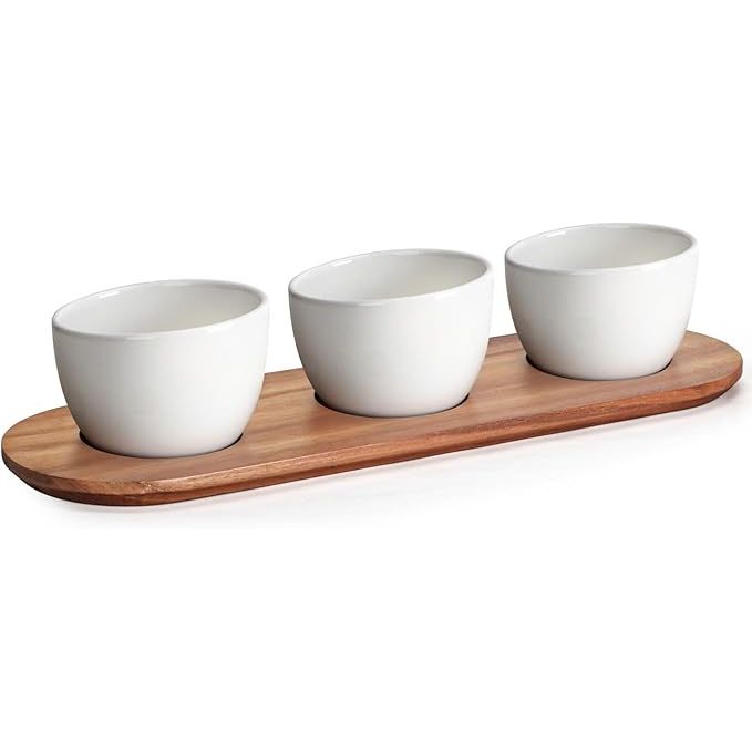 The Chip and Dip Serving Set with Acacia Wooden Tray includes four 12oz white glazed ceramic dipping bowls that are perfect for serving a variety of appetizers and condiments. The set also comes with a beautifully crafted acacia wooden tray that adds a touch of elegance to any table setting.