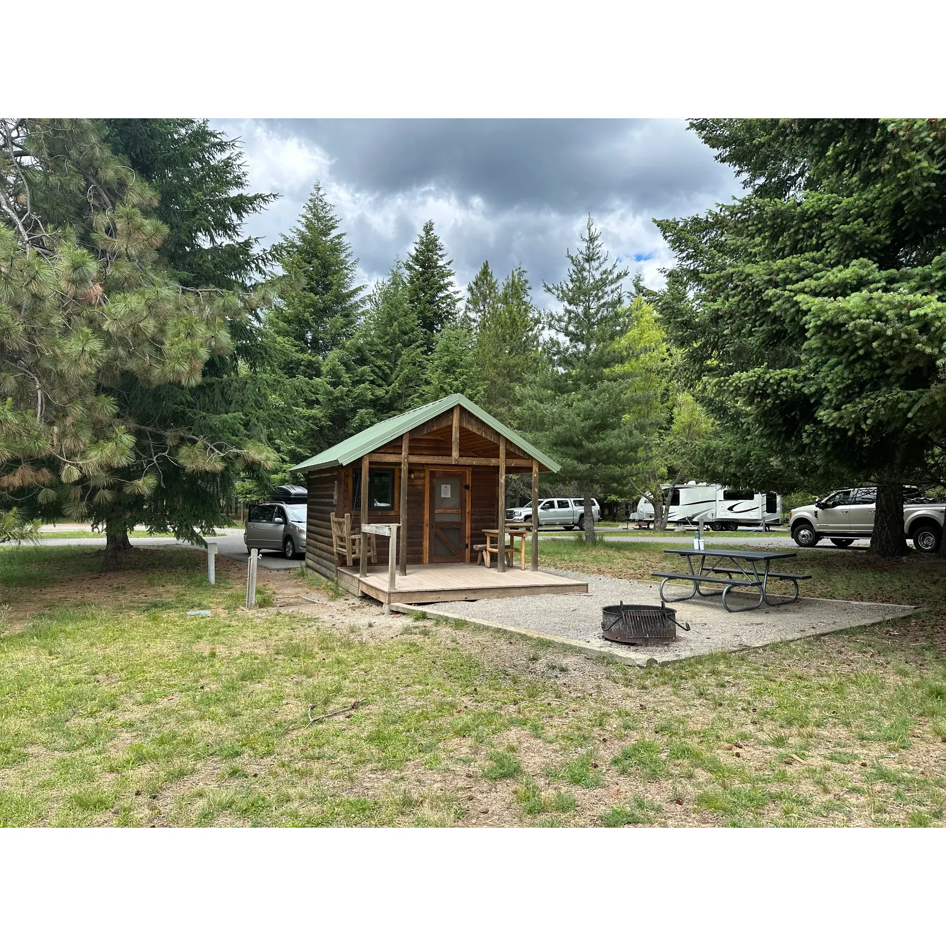 Waldron Campground welcomes outdoor enthusiasts to a serene retreat boasting a harmonious blend of natural beauty and comfort. Situated on the picturesque shores of Lake Pend Oreille, this campground is an idyllic destination for friends and families alike. Formerly a historic navy training base, it now offers a tranquil setting for a variety of activities surrounded by breathtaking landscapes.

The campground itself boasts a variety of accommodation options, with Kestrel cabins providing an ideal mix of rustic charm and modern convenience. Each cabin is equipped with comfortable sleeping arrangements including a futon and a bunk with double mattresses – the real kind – to ensure a restful night's sleep. Additional amenities such as a small table, seating, and a wall unit for temperature control enhance the cozy cabin experience. The cabins feature clean interiors and a delightful patio that opens up to a spacious grassy area, perfect for relaxation or outdoor play.

The well-maintained grounds of Waldron Campground include clean restrooms and shower facilities that are conveniently located. The ambiance is further enriched by the friendliness of both the staff and fellow campers, ensuring a welcoming atmosphere throughout the stay.

For group gatherings, visitors can take advantage of the clean picnic area, fully equipped with ample seating, a serving table, and a magnificent fire pit, perfect for social evenings under the stars. Active guests can explore the campsite's numerous attractions, from enjoying the disc golf courses to embarking on explorative hikes and bike rides along the scenic trails.

Families will appreciate the added touches that make for a delightful vacation, such as swings to entertain younger campers and a quaint book trading library for those looking to unwind with a good read. With spaces that are open, level, and accompanied by convenient facilities like tables, water, and power, setting up the perfect spot is effortless.

Waldron Campground is not only a beautiful place to create lasting memories but also a hub for outdoor adventures on land and lake, embodying the perfect balance between relaxation and recreational activities. Visitors are encouraged to bring along their canine companions, children's bikes, and a spirit ready for fun in the outdoors for a complete and satisfying camping experience. With its popularity, it's advisable to make reservations early, starting in December, to secure your ideal spot in this sought-after destination. Description by ChatGPT.