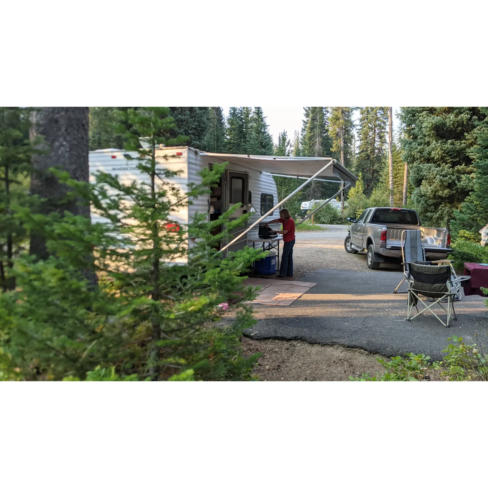 Discover the tranquility and natural splendor of Upper Payette Lake Campground, where campers revel in the pristine beauty of a classic Forest Service campground. Conveniently situated by a glistening mountain lake, the campground offers an ideal setting for enthusiasts who appreciate the simplicity of dry camping. Embrace the fullness of the lake in the early season while the waters invite a plethora of recreational activities, and witness a distinct charm when the late season reveals a different facet of its allure.

Adventure-seekers will find their haven in the abundance of nearby hiking trails that promise rigorous explorations through the forest's lush tapestry. Each campsite presents a serene retreat with a concrete slab and picnic table, poised for campfire tales and stargazing nights. Despite the minimalistic approach to amenities, the campgrounds provide potable water through a traditional pump, encouraging a self-sufficient outdoor experience.

Exceptionally maintained pit toilets underscore the campground's commitment to cleanliness, thanks to the diligent daily efforts of our friendly camp hosts. While this idyllic outdoor retreat requires guests to pack out their trash, it fosters a sense of environmental stewardship and an unbeatable sense of connection to nature. 

For those seeking a getaway replete with breathtaking views, the stark beauty of Upper Payette Lake Campground awaits. Whether you're pitching a tent or rolling in with a camper, allow the mountain vistas to envelop you in serenity. A place where value transcends the simplicity of amenities, this captivating campground invites you to take part in the timeless tradition of outdoor living—it's the perfect backdrop for creating lasting memories at an exceptional price point. Indulge in the pure magic of the wilderness, and like many before, you'll yearn to return to this haven of natural wonder. Description by ChatGPT.