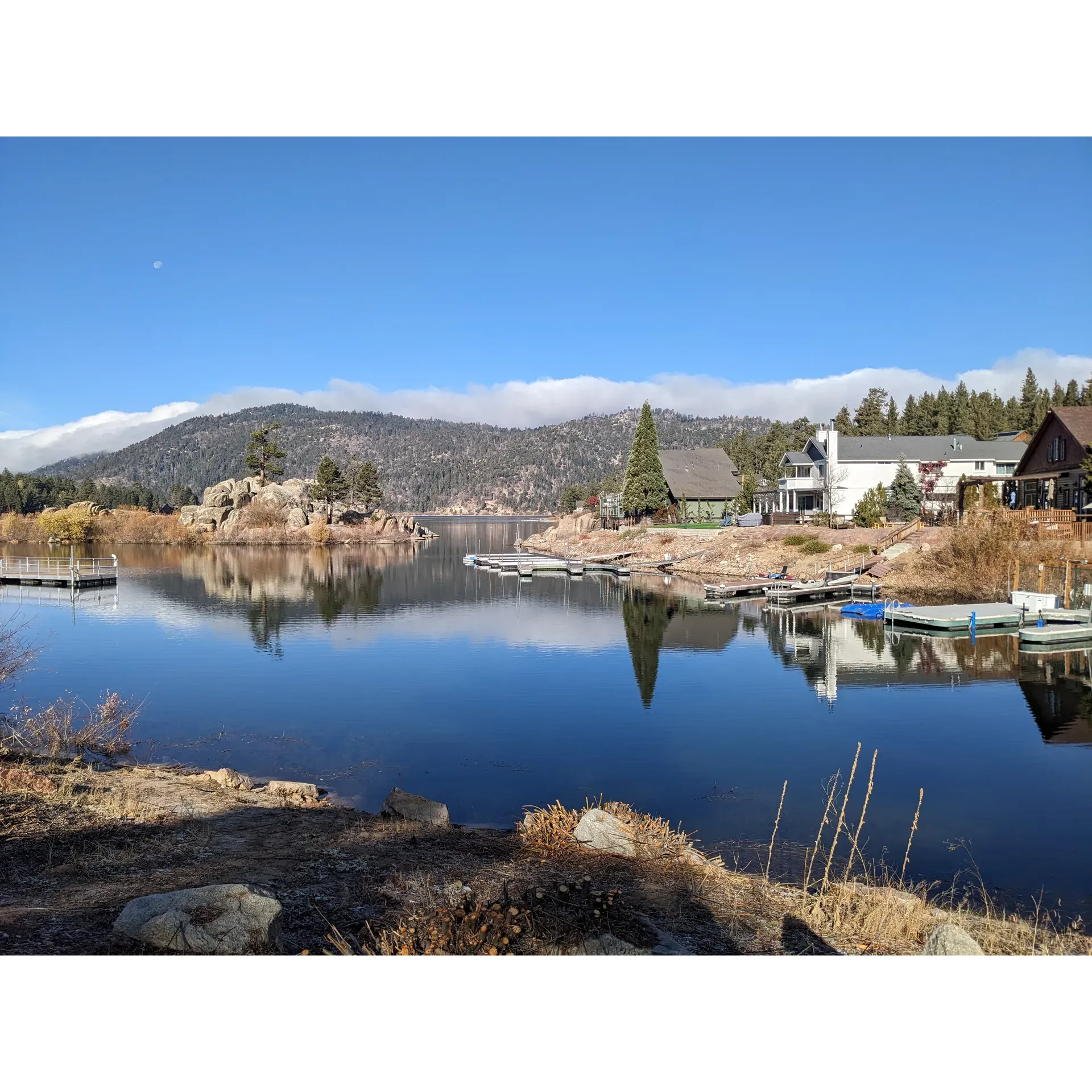 Boulder Bay Park, perched on the shores of Big Bear Lake, offers guests a picturesque retreat perfect for a variety of outdoor activities throughout the year. In the winter, visitors are treated to a breathtaking scenery blanketed in snow, providing a serene backdrop for a chilly yet memorable excursion. To fully enjoy the crisp air and stunning views, be sure to arrive dressed warmly with beanies, gloves, and ear protection.

For those seeking a tranquil spot to unwind, the park's quaint setting features ample amenities, including picnic benches for a leisurely lunch, lush grassy areas for relaxation, clean restrooms for convenience, and a charming gazebo that serves as a focal point for gatherings. Anglers, whether seasoned or novice, will find the park's ramp an ideal spot to cast a line, while families with children can introduce their little ones to the joys of fishing both from the dock and the lakeside closer to the highway.

If you're an early riser, the park provides a magical vantage point to witness the sunrise, painting the sky with vivid hues and amplifying the natural beauty of the surrounding landscapes. On warmer days, Boulder Bay Park is the perfect place for families to stroll and enjoy the sun, making it a versatile destination regardless of the season.

Parking is limited, but the small lot includes accessible spaces for those with handicaps, ensuring that everyone has the opportunity to savor the park's offerings. Regulars recommend stopping by whenever you're in the area, as every visit promises new delights and a chance to relax in one of Big Bear Lake's charming recreational spots. The next time you're considering a day out in nature, Boulder Bay Park awaits with its tranquil charm and a promise of a pleasant outdoor experience. Cheers to your upcoming adventure in this delightful sanctuary! Description by ChatGPT.