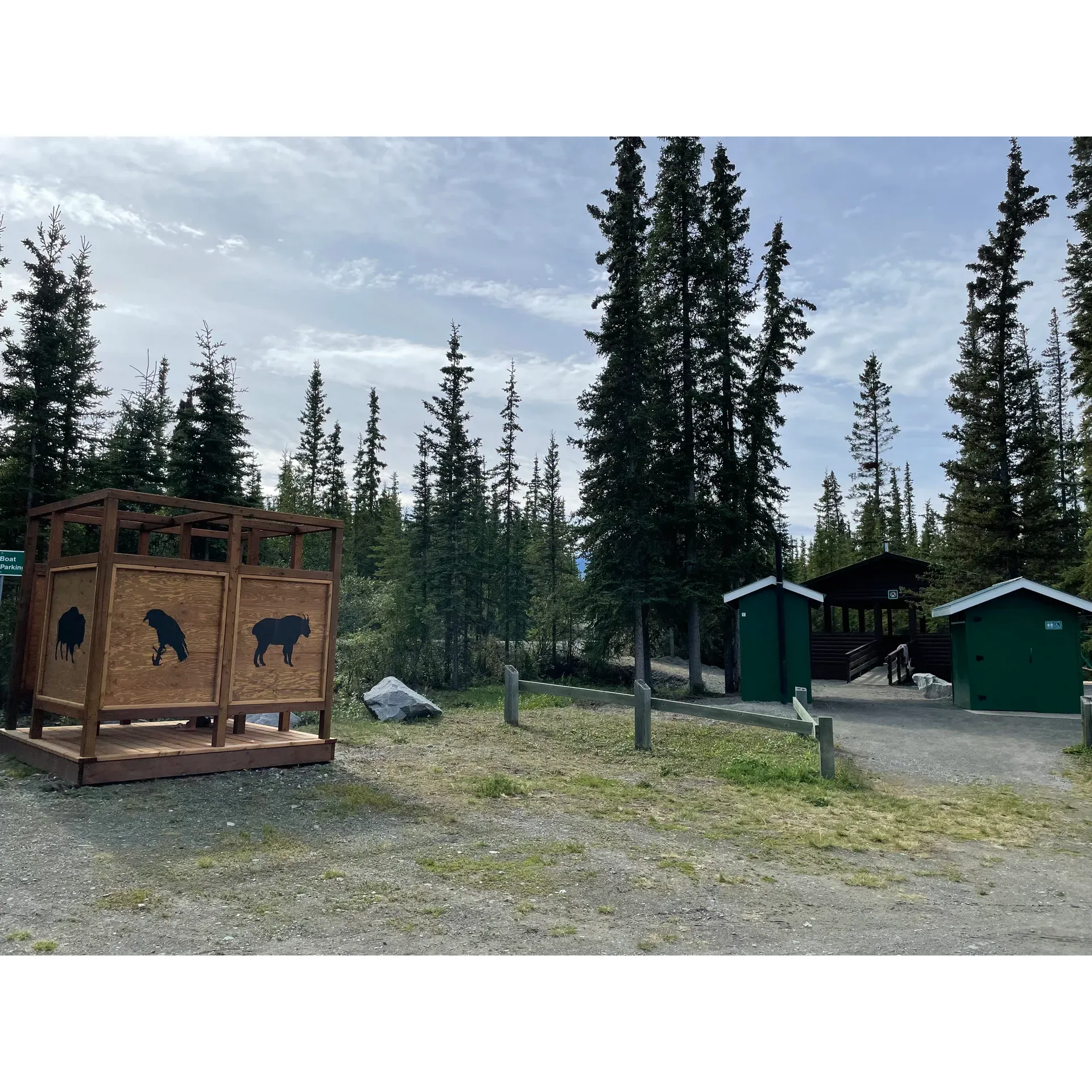 Pine Lake Campground offers a serene outdoor experience for campers and day visitors alike, boasting a stunning lake complemented by a sandy beach that promises relaxation and fun for everyone. It's a tranquil haven for dry camping, where the beauty of nature takes center stage, and the simplicity of the outdoors can be appreciated in all its glory.

Guests at this idyllic campground are treated to spacious pitches that provide an ideal balance of openness and privacy, allowing for a personal retreat amidst the great outdoors. The impeccable maintenance of the area shines through, with clean facilities including latrines and well-kept communal areas equipped with wood burners, adding to the overall comfort of your stay.

Children and families are particularly drawn to the modern playground, an engaging space where kids find delight in features like a thrilling zipline. The thoughtful addition of a warming settler ensures that even on cooler days, the adventures don't have to end.

For those captivated by the natural allure of the waterfront, the boardwalk invites visitors to explore and leads them to the captivating lakeside beach. Here, the shores beckon with opportunities for relaxation, while a public boat launch and dock cater to aquatic enthusiasts eager to venture onto the lake. Anglers can indulge in the joy of fishing, with guidelines in place to maintain the local ecosystem's health.

The conveniences of civilization are just a stone's throw away, with the proximity of Haines Junction offering access to essential services including drinking water facilities, a beloved local bakery, and the Yukon Visitors Center, enriching the campground experience with a taste of local culture and conveniences.

Nature lovers can immerse themselves in the spectacular scenery and wildlife that adorn the area, creating a backdrop that ensures every day at Pine Lake Campground is filled with beauty and discovery. With glowing reviews and guests eager to return, this campground is truly a gem for those seeking an outdoor escape paired with the comforts and joys of a well-maintained recreational haven. Description by ChatGPT.