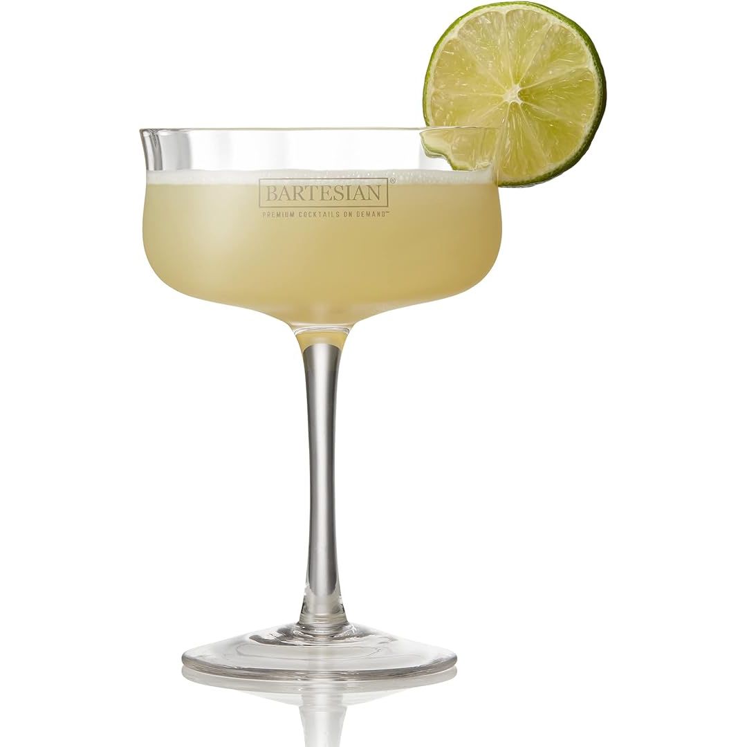 Elevate your cocktail game with our modern coupe glass, designed to bring out the best in your Bartesian creations. Each glass is a work of art, crafted to enhance the flavors of your drink and create a visually stunning presentation. Made from blown glass, our glassware combines durability with elegance for a truly special sipping experience.