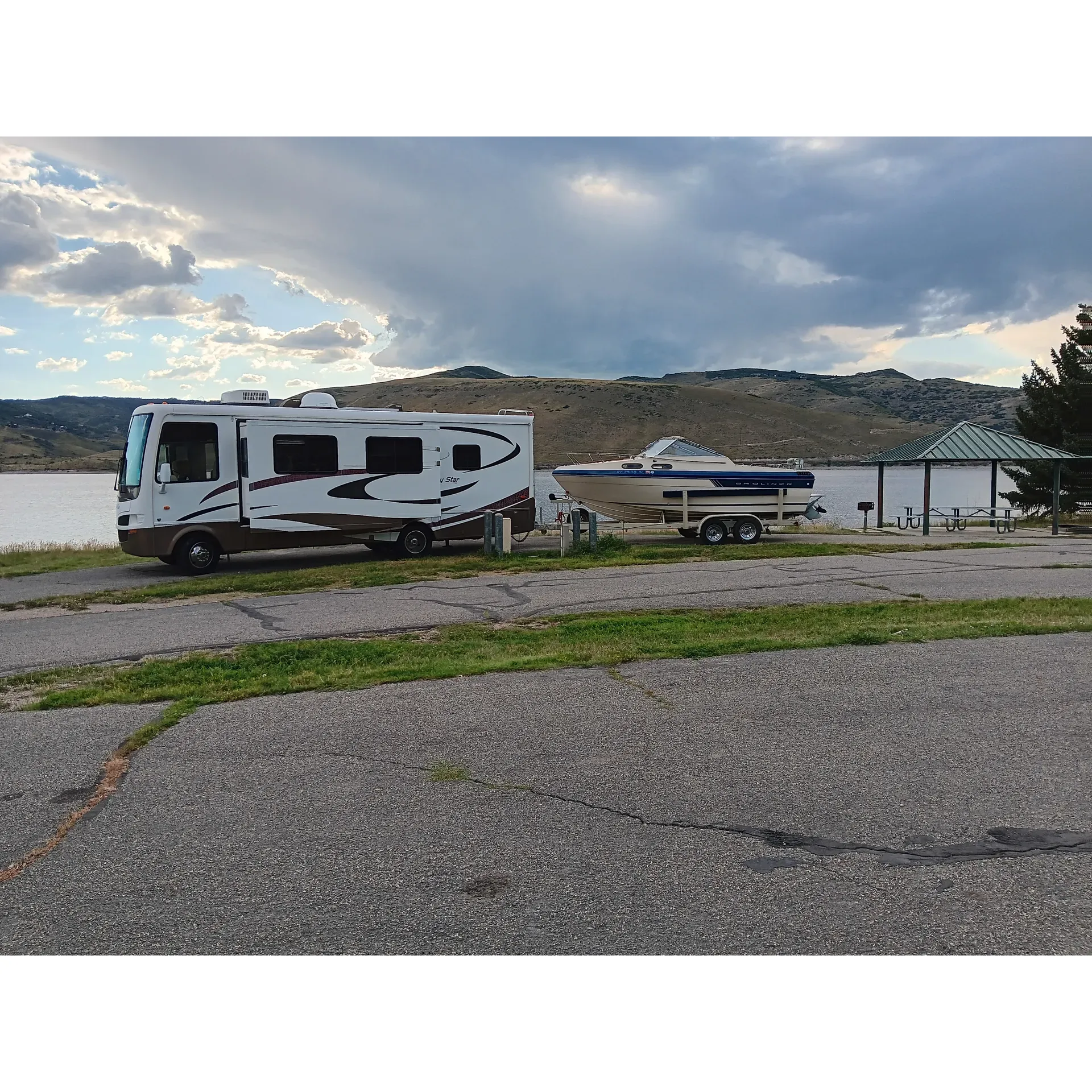 Juniper Campground is an idyllic retreat for outdoor enthusiasts seeking a blend of convenience and adventure. With fully-equipped campsites that boast running water and power outlets, guests can enjoy the comforts of home while being surrounded by nature. The campground offers modern amenities including flushing toilets and showers, ensuring a comfortable stay for all.

Situated by a picturesque lake whose levels have been pleasantly high in recent years, Juniper Campground provides guests with effortless access to water activities and relaxation. The proximity of the lake means refreshing swims and leisurely strolls to the water's edge are moments away from your tent. In previous seasons, the water's embrace has been just a short walk from the campsite, allowing visitors to maximize their time engaging with the serene aquatic surroundings.

The pleasant climate, despite the warmth, is perfectly complemented by the cool, refreshing river that flows nearby, offering a natural respite for those warm summer days. The campground is renowned for its tranquility, especially at the far end of Rockport State Park, where the quietude of the setting lends itself to a restful getaway.

Visitors often remark on the excellent management and maintenance of the facilities. The cleanliness of the bathrooms and showers is consistently praised, with showers designed for simplicity and ease of use. For boating enthusiasts, Juniper Campground is an absolute haven featuring what is regarded as the best boat ramp in the area, providing ample space for launching boats with ease.

The beauty of the campsite's surroundings is only heightened by the magnificent lake views, creating a picturesque backdrop for every camping experience. While shade might be moderate in some areas, the proximity to the water allows for a delightful breeze and the camp hosts are commended for their exceptional upkeep of the sites.

Whether you're returning to the joys of camping after a hiatus or are a local resident looking for a splendid escape close to home that combines the best of land and water, Juniper Campground is an excellent choice to create lasting memories amidst the beauty of nature. Description by ChatGPT.