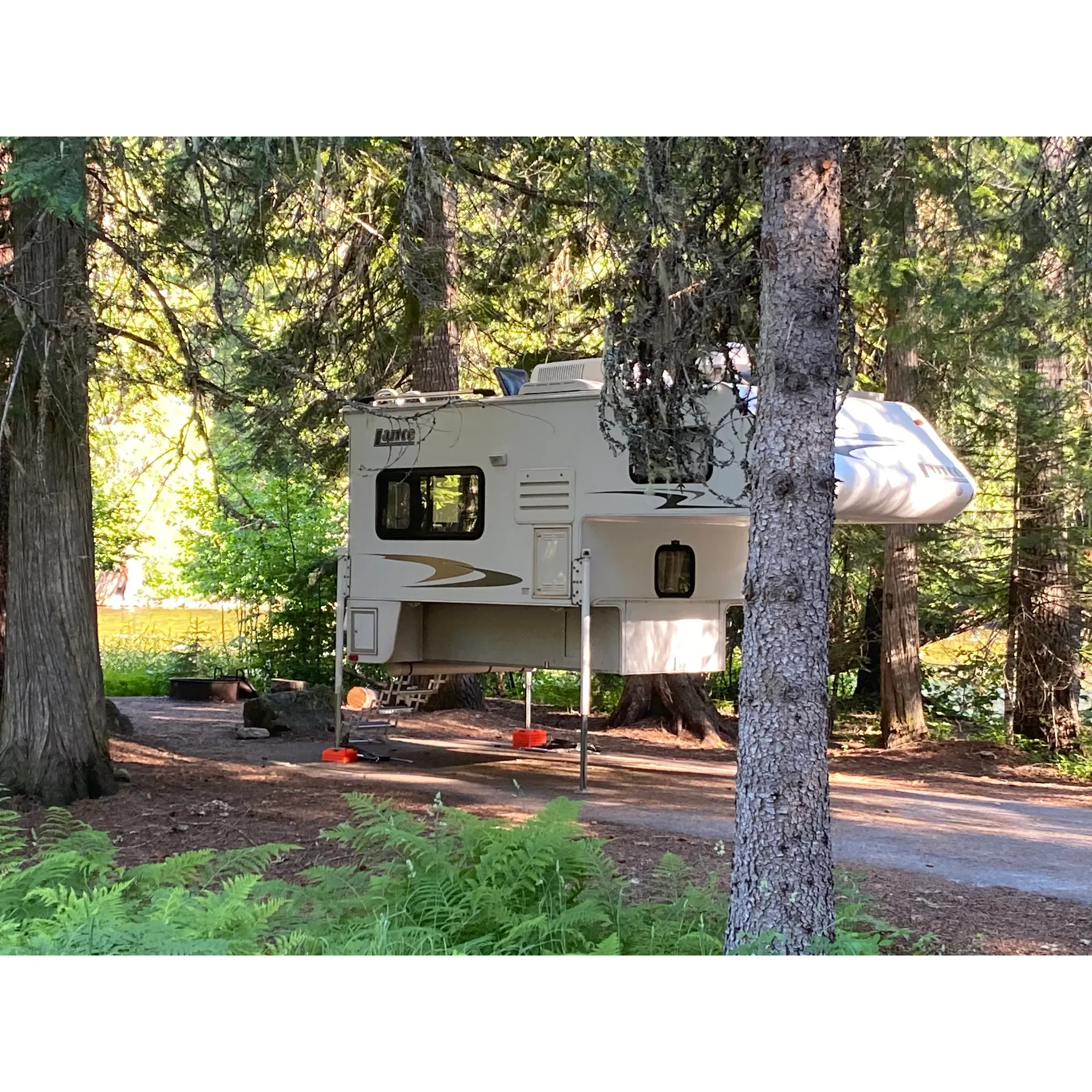 Escape to the tranquil retreat of Whitehouse Campground, an idyllic destination for campers seeking the serenity of nature without straying too far from conveniences. Set against a backdrop of lush greenery and ever-present cedar trees, visitors are treated to the delightful murmur of the Lochsa River, creating a soothing sonic tapestry that enhances the camping experience. The river views are incomparable, offering picturesque settings and a captivating environment for anglers, where fishing is nothing short of fantastic.

The campground prides itself on its exceptionally clean facilities, ensuring the utmost comfort for guests throughout their stay. Spacious, well-maintained campsites provide ample room for relaxation and recreation, each basking in the dappled shade that affords respite from the afternoon sun. The campground's proximity to the road is cleverly mitigated by the dense canopy of trees, ensuring the natural soundscape remains undisturbed.

Venture out for a day trip and revel in the majestic panoramas at Tom Beal Park and Lolo Motorway, where the vistas promise awe-inspiring splendor that beckons hikers and sightseers alike. For those seeking a break from campfire cooking or in need of provisions, the nearby Lochsa Lodge offers both culinary delights and a well-stocked store, alongside fuel services for your convenience. The lodge is also a haven for connectivity, providing WiFi to keep guests in touch with the world, or to simply share moments from their adventure.

The Whitehouse Campground isn't just for the solitary wanderer; it's a place where a community thrives. It has become a cherished annual tradition for many, where each visit breathes opportunities to forge new friendships amidst the beauty of nature. Inviting, serene, and enveloped by the natural world, the campground serves as the perfect launchpad for an authentic outdoor experience along the Lochsa River, beckoning adventurers to return season after season. Description by ChatGPT.