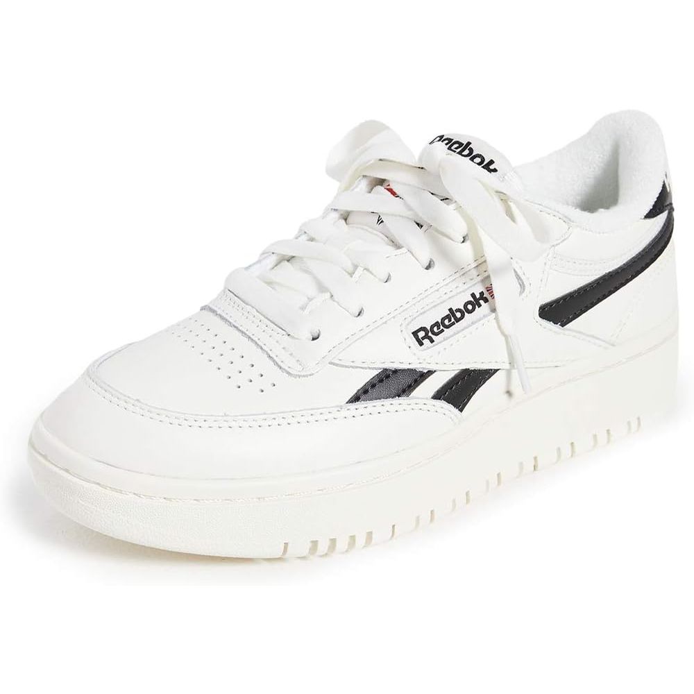 The Reebok Women's Club C Double Sneaker is a stylish and versatile shoe that combines classic design with modern details. This sneaker features a double-stacked sole for added height and a unique look. The upper is made of soft leather for durability and comfort, while the cushioned footbed provides all-day support.