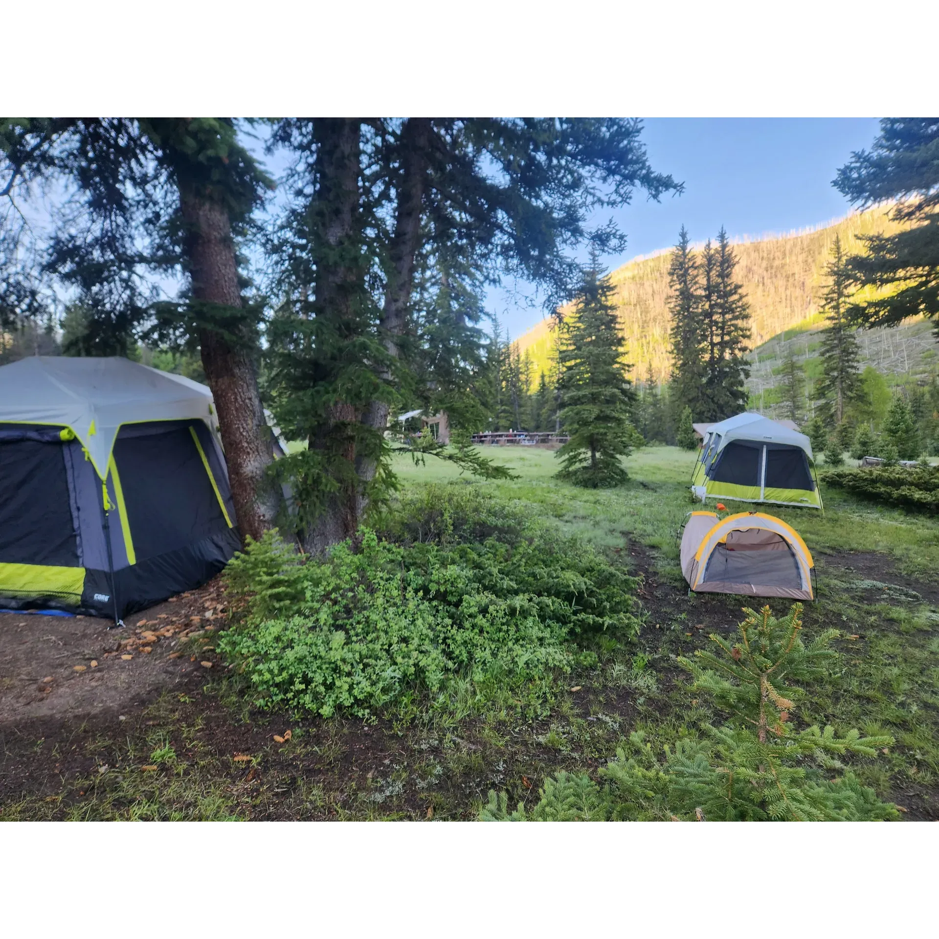 Old Folks Flat Group Campground offers a serene outdoor experience that is sure to please nature lovers and camping enthusiasts alike. This welcoming campground is a prime choice for groups seeking spacious areas for their trailers and tents. With a capacious gravel parking area, visitors have plenty of room for their vehicles and camping equipment, ensuring a comfortable and uncramped environment.

Campsites are positioned conveniently close to clean, flush bathroom facilities and easily accessible water sources, adding an element of comfort to the rustic adventure. Guests have praised the cleanliness and the thoughtful layout of the campground, which affords a sense of privacy and tranquility while being close enough to foster a sense of community with fellow campers.

Not only is the campground well-maintained, but also strategically located just a short distance from a lake and numerous off-roading trails while maintaining a tranquil ambiance free from the buzz of ATV traffic. The proximity to recreational water activities is a delightful bonus for those who enjoy boating, fishing, or simply the peaceful view of water.

The allure of Old Folks Flat Group Campground is further enhanced by its beautiful natural surroundings. The site boasts a picturesque landscape, characterized by a harmonious blend of spruce and aspen trees. This scenic beauty also provides a habitat for local wildlife, allowing guests to witness the splendor of animals in their natural environment.

With its fresh, cooler temperatures at high elevations and the gradual recovery of the land from past environmental events, the campground remains a testament to the resilience and enduring charm of the wilderness. A few minutes away, the Cleveland reservoir expands recreational options, promising additional scenic views and fishing opportunities.

Guests at Old Folks Flat Group Campground can expect a pause from the digital world, offering a rare chance to disconnect and immerse fully in the camping experience. With an array of comfortable amenities, ample space, and magnificent natural beauty, this campground is a true haven for groups looking to create lasting memories in the great outdoors. Description by ChatGPT.