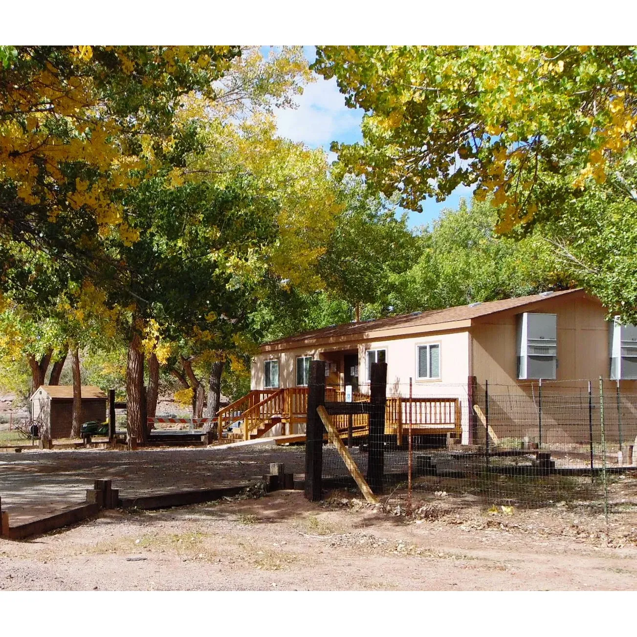 Immerse yourself in the serene beauty and rich cultural heritage of the Tséyi' Diné area at Cottonwood Campground, a charming retreat located mere moments from the majestic Canyon de Chelly National Monument. The campground offers an affordable getaway with spacious, shaded sites that are both paved and flat, perfect for tent campers and RV enthusiasts seeking an escape from the everyday hustle.

Visitors can enjoy the tranquility of the campground, surrounded by the soft whispers of cottonwood trees, and relish in a setting that is both peaceful and clean. While the campground facilitates dry camping with the absence of hookups, guests have access to essential amenities like potable water, a convenient RV dump station, and restrooms maintained to ensure a comfortable stay.

Cottonwood Campground's unique advantage is its proximity to both nature and necessities. A short stroll away, guests will find the Canyon de Chelly Visitor Center, the historical Thunderbird Lodge with its trading post and delightful restaurant, and several breathtaking overlooks along the rim road, just a quick drive away – making it the perfect basecamp for exploring the natural wonders without a lengthy journey.

In the spirit of a true community, the campground fosters a friendly atmosphere where campers are known to share helpful tips and stories. The process for securing a spot is straightforward – simply pay with cash, deposit the envelope, and settle in. Should you need assistance, ranger contact information is readily displayed.

Moreover, the campground's layout is designed to provide guests with the comforts they need. Restrooms are kept clean and well-stocked, while trash stations and grills are diligently maintained. For dining convenience, the nearby Thunderbird cafeteria welcomes diners until the evening, ensuring that your adventures are complemented by satisfying meals.

Cottonwood Campground is not just a place to stay; it's a place to experience the harmony of nature and the warmth of communal spirit, all while discovering the ancient stories etched within the walls of Canyon de Chelly. Whether lingering for a night under the canopy of stars or setting up camp for a longer exploration, this heritage area offers an enriching and unforgettable natural escape. Description by ChatGPT.