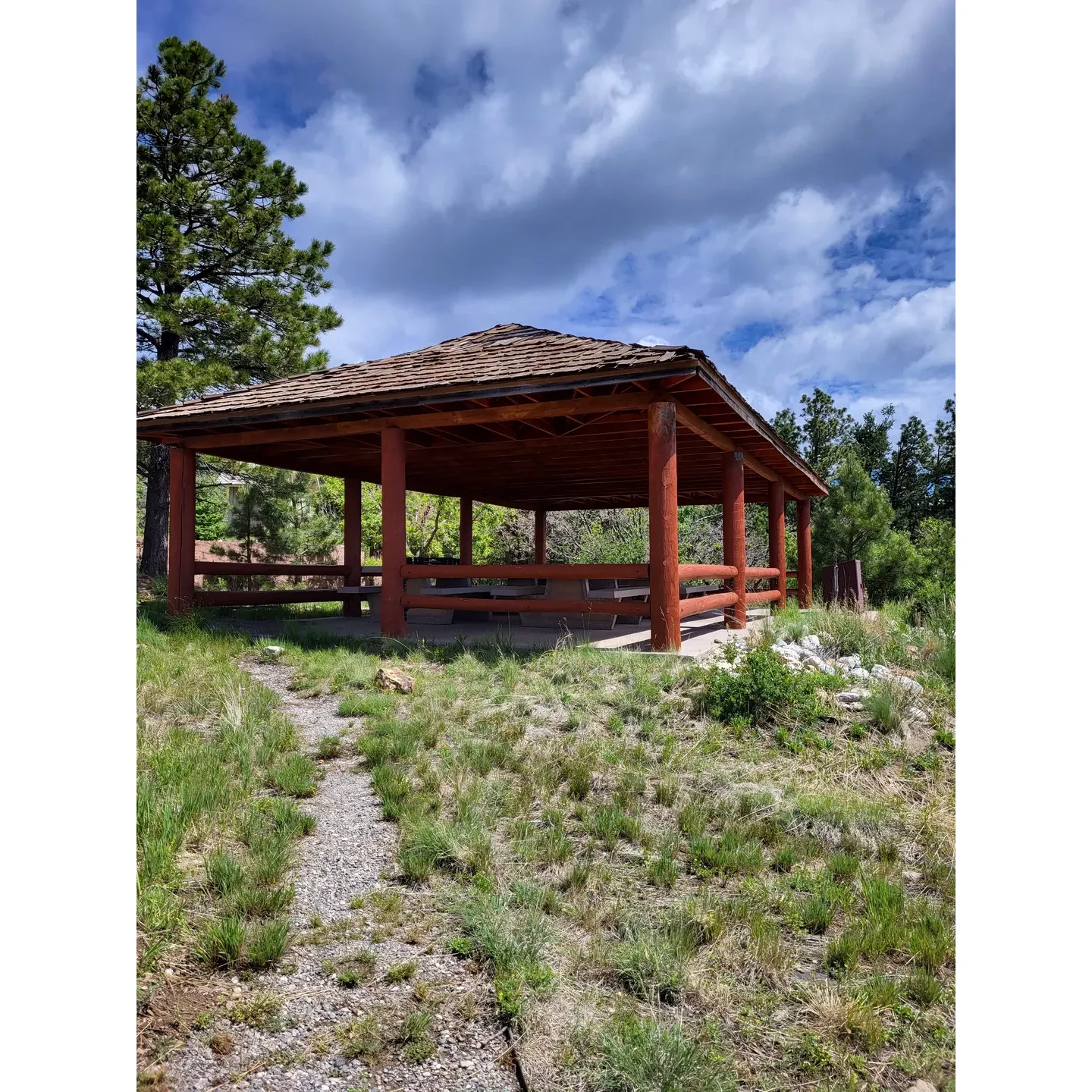 Capilla Peak Campground is a majestic haven for camping enthusiasts situated at a breath-taking altitude of 9000 feet, providing a serene retreat for those seeking peace and solitude amidst nature. With eight available spots, campers can enjoy the well-appointed sites that come equipped with picnic tables and fire pits, where three sites benefit from protective awnings, offering shade and shelter in this beautiful mountain setting.

As a testament to its exclusivity and charm, the journey to Capilla Peak Campground involves a scenic drive on a well-maintained, graveled road that meanders for about nine miles through the landscape, ensuring accessibility without the concern of muddy conditions. It is best suited for vehicles up to 20 feet in length, keeping the setting intimate and uncrowded.

The campground boasts essential amenities such as two clean bathrooms and a community picnic table area, making it possible to enjoy the outdoors even when all camping spots are taken. The surrounding area exudes tranquility and natural beauty, rarely filled even on the weekends, offering plenty of space for everyone.

Visitors to Capilla Peak Campground can indulge in gentle hikes on nearby trails, revel in the stunning panoramic views, or engage with the local wildlife, including frequent deer sightings. For the more adventurous, there are longer trails like the Crest Trail that offer more rigorous hikes through the pristine environment.

In close proximity to an observatory, the campground presents an opportunity for stargazing and connecting with the cosmos. Its remarkable cleanliness and well-maintained facilities ensure a comfortable and enjoyable stay, making Capilla Peak Campground an ideal destination for nature lovers and campers who desire a pristine and reflective escape from the hustle and bustle of daily life. Description by ChatGPT.