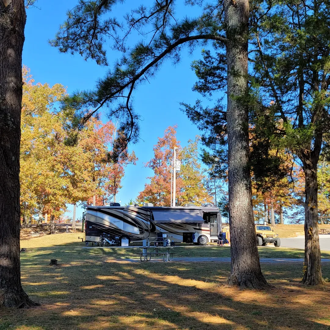 Tims Ford Fairview Campground presents an ideal getaway for adventure enthusiasts and peace seekers alike. Revel in the serenity of a waterfront paradise where the tranquility of nature envelops you. The campground is applauded for its quiet ambiance, providing a soothing retreat for those looking to escape the hustle and bustle of daily life.

Spacious sites welcome both grand RVs and quaint campers, ensuring ample room for all types of outdoor enthusiasts. Regular visitors laud the campground for its cleanliness and comprehensive amenities, including full hookups with water, electric, and septic, catering to the convenience of all guests.

Family and community bonds flourish here, as the campground often buzzes with the warmth of shared meals and the cozy glow of campfires beneath a canopy of stars. Experience the joy of camaraderie as families and friends gather, creating lasting memories in a convivial setting.

The campground's backdrop is a picturesque view that paints every camping experience with strokes of beauty and calm. Those who relish the great outdoors celebrate this spot as their favorite local destination, where the attentive hosts strive to maintain a welcoming and orderly environment.

For the discerning camper, amenities such as well-maintained bathhouses provide a clean and efficient space to refresh after a day of outdoor leisure. And when the winter season beckons with its quiet charm and snowy wonder, Tims Ford Fairview Campground transforms into an enchanting enclave for those prepared to delight in the cooler, tranquil moments by the water's edge. This treasure of a campground promises to be a place you'll be eager to return to, season after season. Description by ChatGPT.