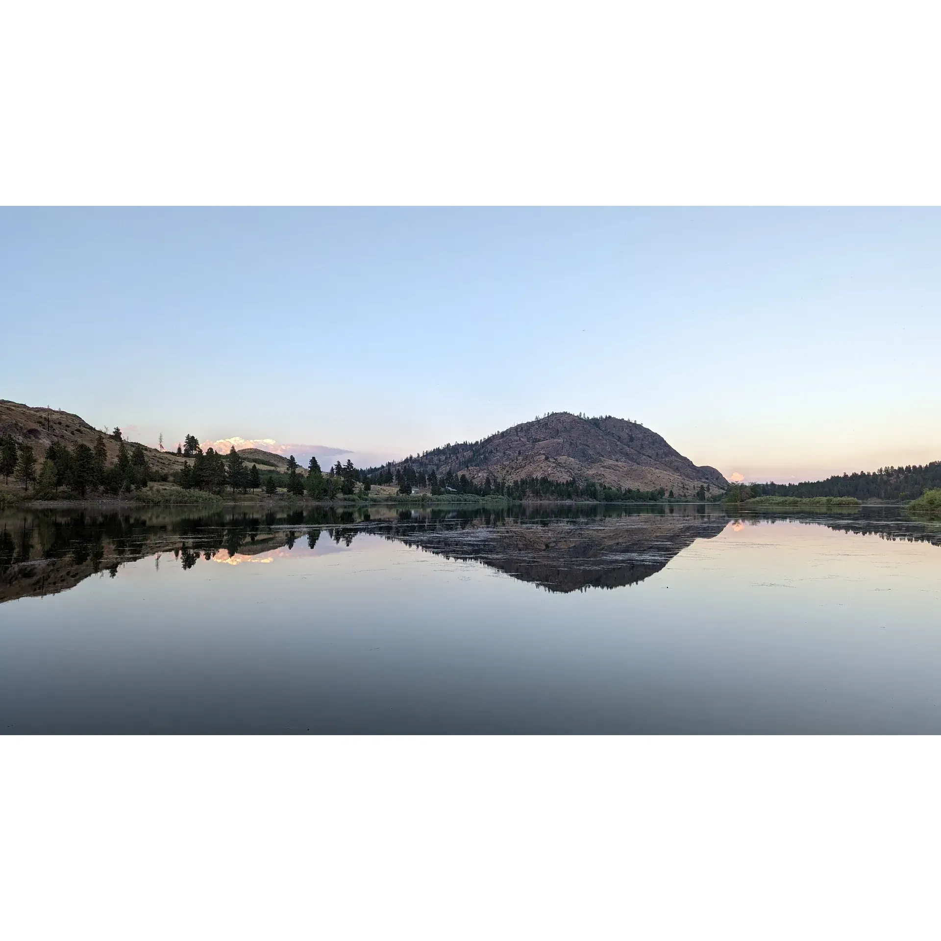 Leader Lake Campground offers a tranquil and picturesque outdoor experience perfect for adventurers and nature enthusiasts alike. Conveniently located close to Omak, it provides an ideal retreat for visitors attending local events such as the annual stampede, offering a peaceful environment to relax in after the day's excitement.

Set in a serene lakeside setting, the campground charms its visitors with the surrounding pine trees and the gentle sounds of a nearby stream, enhancing the natural ambiance. Each of the seven well-maintained campsites comes equipped with fire pits and picnic tables, allowing guests to fully immerse themselves in the camping experience.

The campground is particularly popular with fishing aficionados, boasting a great medium-sized lake that is easily accessible from the campsites. The lake offers an abundance of fishing opportunities with plentiful areas to cast your line and the chance to catch bluegill and perch from the shore. The cool, clean waters just beyond the water's edge provide a refreshing escape on warm days.

Outdoor enthusiasts visiting during the off-peak season, such as October, have found Leader Lake to be a hidden gem, often enjoying the serenity of having the lake all to themselves during quieter times of the year. Views from the campground are truly incredible, allowing for moments of reflection and a connection with the great outdoors.

Those exploring the area on two wheels, such as motorcyclists traversing the Washington Backcountry Discovery Route (WABDR), will find Leader Lake Campground an accessible and relaxing stopover. Its proximity to the highway ensures it's a breeze to find, while still offering the sense of seclusion one seeks when camping.

With its beautiful lake atmosphere, easy access to fishing, and calm surroundings, Leader Lake Campground remains a cherished spot among campers and local residents alike. Its idyllic location, functional amenities, and inviting natural setting make it a treasured escape in the Washington outdoors. 

Whether you're looking for a quiet fishing getaway, a convenient camping spot during local festivities, or a lone night under the stars, Leader Lake Campground is well-suited to provide an accommodating and scenic experience. Description by ChatGPT.