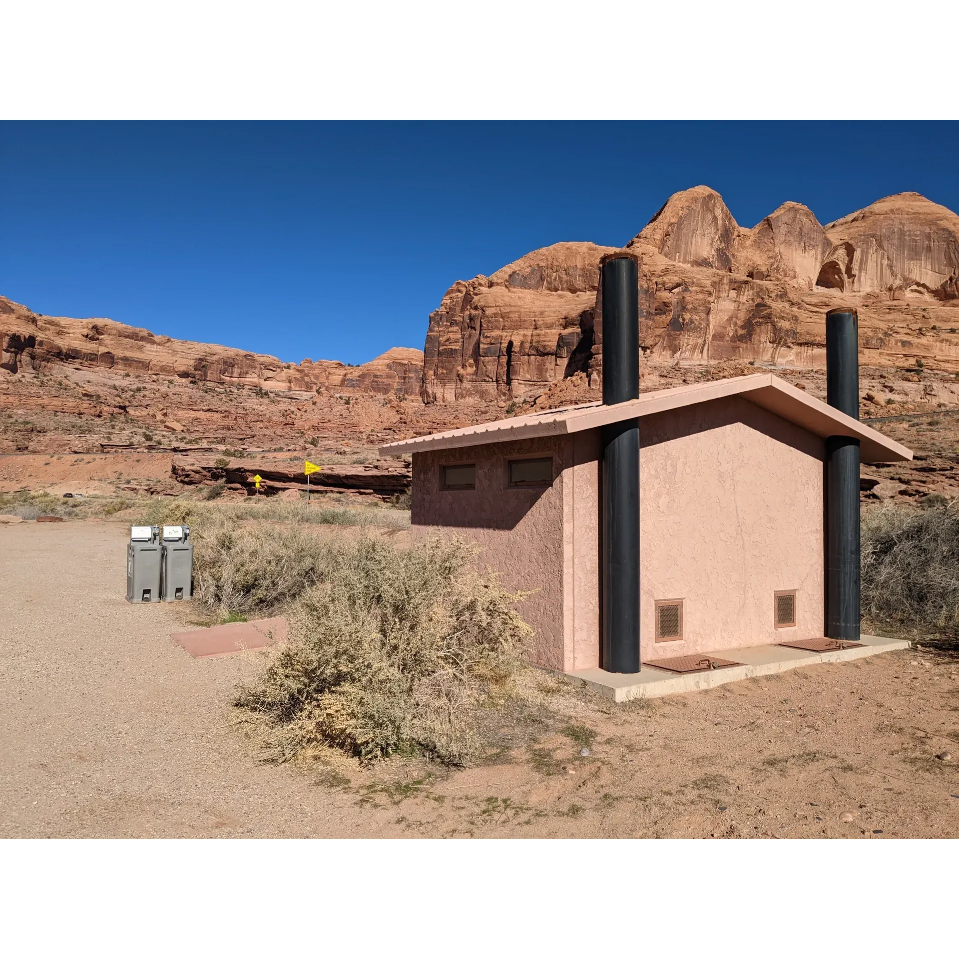 Gold Bar Group Campground offers an exceptional outdoor experience with its impressive 360-degree views that leave visitors awestruck. Boasting prime location right across from the Corona Arch trailhead, it is an ideal starting point for adventurers looking to explore breathtaking hikes immediately upon stepping out of their tents. The campsite's grounds receive high marks for cleanliness, with well-maintained facilities including stocked and tidy outhouses for convenience.

Guests can enjoy the unique experience of dining al fresco with the view of iconic arches, right from their picnic tables, adding a touch of natural grandeur to every meal. The Campground's proximity to scenic river locations provides a picturesque setting for picnics as well as opportunities for cooling off in the shallow river waters, making for a refreshing retreat on hot afternoons.

The Campground does not fall short on space, offering a spacious area that accommodates campers comfortably. The grounds cultivate a sense of serenity and privacy, with ample distance between sites helping to maintain a peaceful environment. For those seeking evening entertainment, the presence of native wildlife, such as bats gracefully swooping in the twilight, adds a delightful spectacle to an evening around the campfire.

The newly installed campfire areas are perfect for socializing and enjoying the warmth on cooler evenings, while the surrounding environment is perfect for those looking to disconnect, as the area lacks cell reception, encouraging visitors to immerse fully in the natural experience.

For those traveling with ice chests, the Campground is accommodating, ensuring that everyone can have cold refreshments on hand to beat the desert heat. Campers can also appreciate the benefit of having level campsites that are ideal for setting up tents easily and comfortably.

Situated within a comfortable drive from Moab and the entrance to Arches National Park, the Gold Bar Group Campground serves as a serene base camp for exploring the stunning landscapes of the region, with the added perks of enjoying star-filled night skies and the simple pleasures of nature's beauty. Remember to bring your own water to stay hydrated under the desert sun, as potable water is not available on site. Gold Bar Group Campground presents an unforgettable experience for those seeking tranquility, natural beauty, and the spirit of outdoor adventure in one of the most striking settings imaginable. Description by ChatGPT.