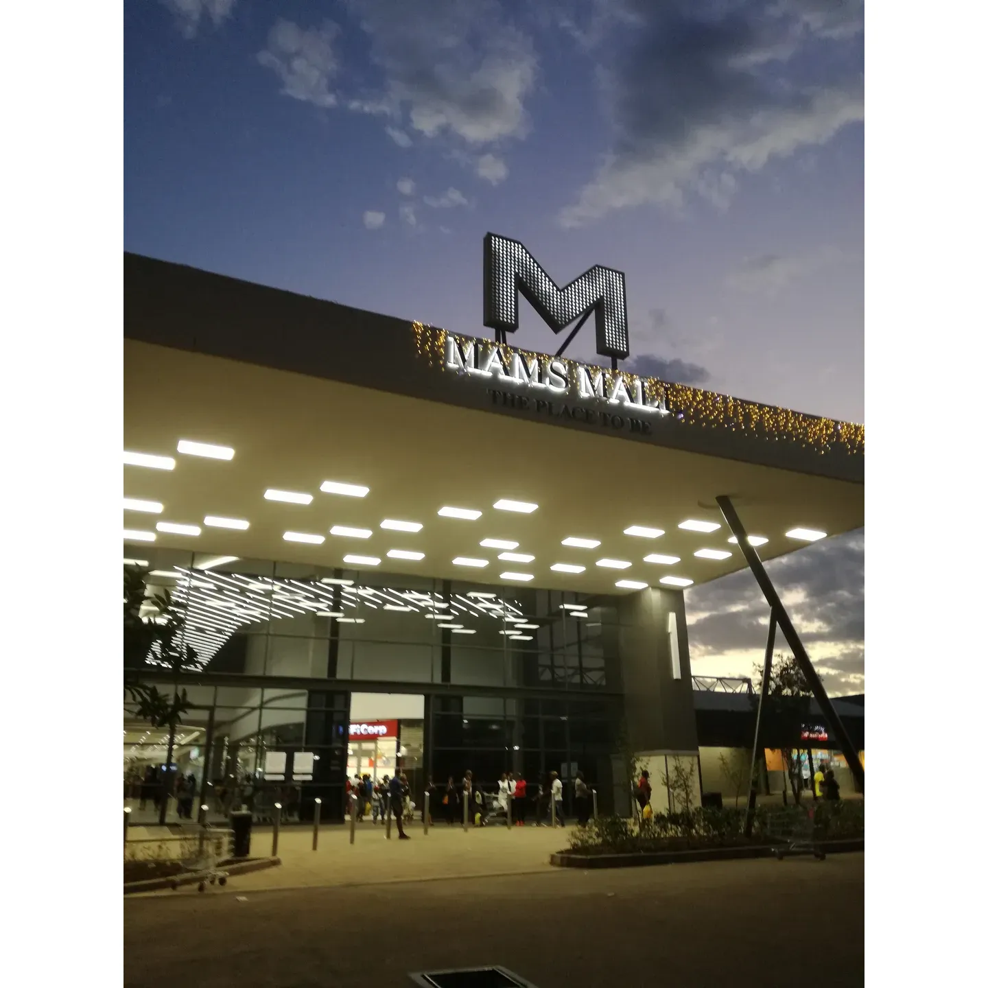 Pick n Pay Mahube Max-City is an integral part of the dynamic and vibrant retail experience at Mams Mall, a premier family-friendly shopping destination renowned for its diverse selection of stores. From fast food to sit-down restaurants, customers can enjoy an array of dining options before or after their visit to Pick n Pay.

The supermarket itself is recognized for its warm and inviting atmosphere, where customers are greeted with smiles and assisted with enthusiasm. The team at Pick n Pay Mahube Max-City is committed to providing excellent customer service, and patrons often note the staff's friendliness and their eagerness to ensure a pleasant shopping experience.

The wide aisles and well-stocked shelves at Pick n Pay offer a variety of goods, catering to all your household needs. From fresh produce to pantry staples, and personal care items to home essentials, shoppers can find everything they require under one roof.

Pick n Pay Mahube Max-City also boasts a strategic location within Mams Mall, which is rapidly expanding its retail offerings, including exciting additions like Spar and Spar Liquor. This accessibility and convenience make it a favorite choice for community members looking to complete their shopping in a comfortable and accommodating environment.

With a keen focus on customer satisfaction, the staff's understanding and conscientious approach shine through, reinforcing the retailer's reputation for great service. Whether it's for your weekly grocery haul or grabbing the essentials, Pick n Pay Mahube Max-City is a dependable and enjoyable shopping hub in the heart of the community at Mams Mall. Description by ChatGPT.