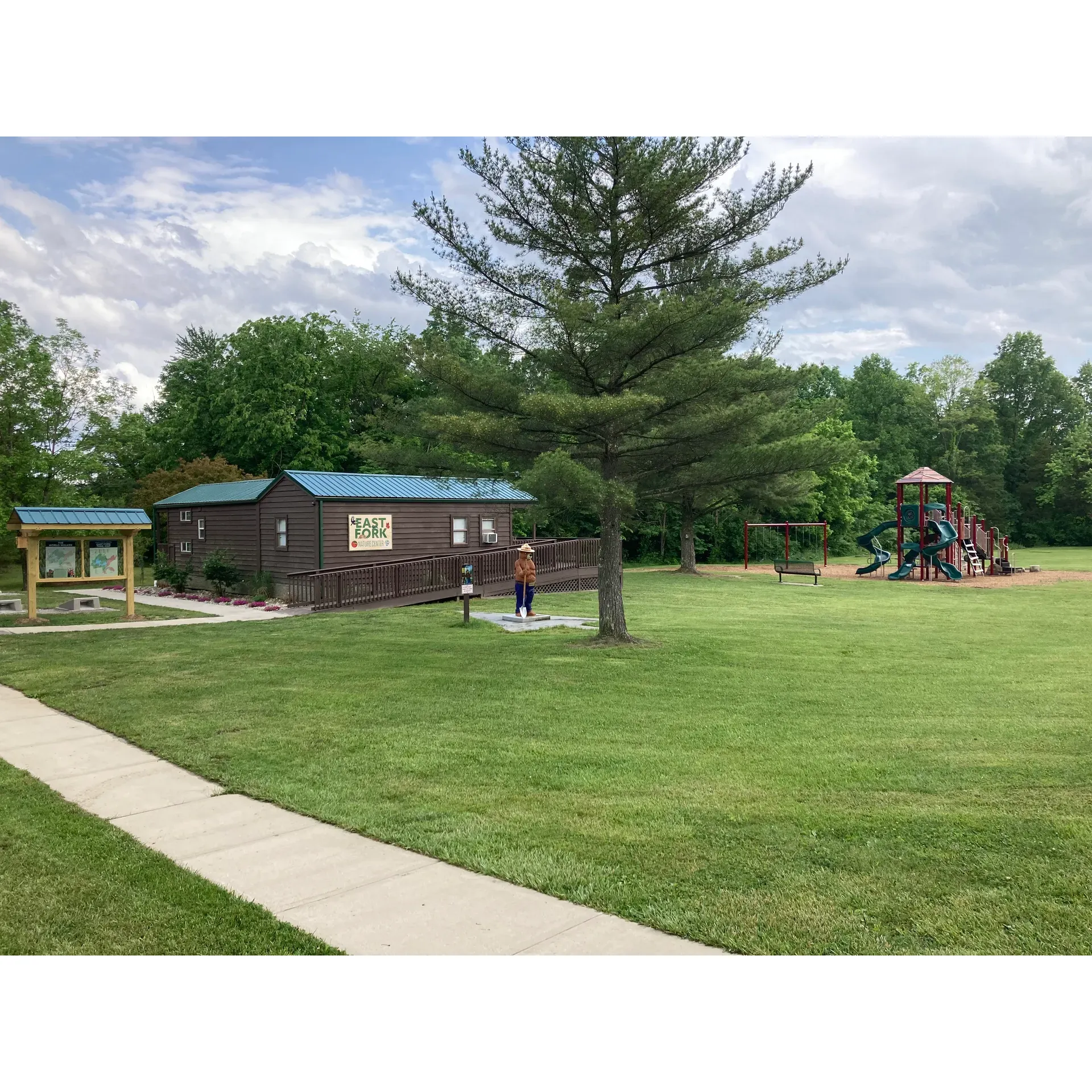 East Fork State Park Campground is a sprawling outdoor haven, where vastness meets a welcoming atmosphere, offering an array of well-equipped and spaciously appointed campsites. Visitors can delight in the serene environment where each site presents a scenic retreat complemented by abundant shade trees, providing relief from the sun and a natural barrier against insects. Campers can enjoy the conveniences of electric hookups, level slabs, fire rings, and picnic tables, ensuring a comfortable and relaxing outdoor experience.

With a focus on cleanliness and maintenance, the grounds are meticulously kept, reflecting the park's commitment to offering a pristine camping backdrop. The park benefits from an attentive and skilled staff, lauded by visitors for their competence and readiness to assist campers in times of need, delivering exceptional service that enhances the overall camping adventure.

The Campground boasts full hookup sites for a more complete stay, allowing guests to connect seamlessly with the environment while having access to modern amenities. For those seeking out a more rugged natural experience, there are options to reserve a spot with convenient access to water spigots and grey water dumps, contributing to an effortless setup for RVs and trailers.

Outdoor enthusiasts will find an abundance of activities to indulge in - from bike trails inviting leisurely rides through lush landscapes, to beaches offering a perfect spot to unwind. The park's vastness facilitates a multitude of recreational opportunities, including hiking, playing at the multiple playgrounds, and immersing oneself in activities like mini golf, ensuring that every visit is filled with excitement and fun.

Strategically located close to Cincinnati, East Fork State Park Campground provides a nature escape with easy access to urban amenities. Just outside the park, a convenient store caters to last-minute needs, offering fuel, ice, wood, and more, while a nearby food truck park presents a delightful array of dining options to enrich the camping experience.

With online reservations ensuring a seamless booking process, East Fork State Park Campground emerges as an idyllic destination for year-round camping escapades. Whether looking for peace and tranquility or an active outdoor getaway, campers are bound to find their own slice of paradise within this expansive and vibrant park. Description by ChatGPT.