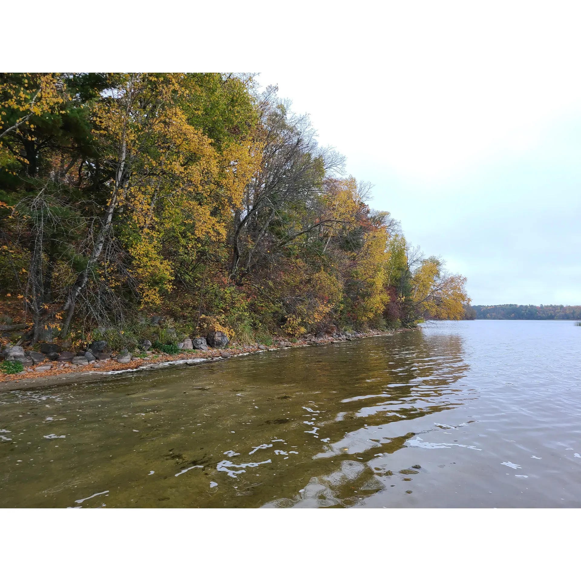 Deer Lake Campground offers a serene outdoor experience, ideal for those who appreciate the tranquility of nature. This picturesque campground, with an array of spacious sites, is a haven for camping enthusiasts who prefer tents or have sizable RVs. With multiple launching points, visitors who have a fondness for boating will find Deer Lake Campground to be perfectly accommodating.

The campground also boasts a couple of beaches, providing excellent spots for relaxation and sunbathing. Beach access directly from selected campsites adds to the convenience for visitors looking to soak up the waterfront ambiance. For those seeking a refreshing dip, water shoes are recommended to fully enjoy the swimming opportunities.

Emphasizing a rustic charm, the campground features beautiful, well-maintained sites that offer easy access to the crystal-clear lake and an extensive trail system perfect for exploration. Although there is no electricity at the campground, which adds to its back-to-basics appeal, it is equipped with old-school water pumps and clean, rustic bathrooms that enhance the overall outdoor experience.

Visitors can gather around their campfires (with their own firewood) under the starlit sky, contributing to the family-friendly and welcoming atmosphere. The campground's secluded location ensures a peaceful retreat, with quiet, relaxing beaches where nature's tranquility is at its best.

During your stay, all your basic needs can be met as nearby amenities, like the Winnie Trading Post, offer essentials such as propane. Overall, Deer Lake Campground is recognized for its peaceful setting, friendly ambiance, and well-kept facilities, all of which combine to create a memorable camping experience for families and outdoor enthusiasts alike. Description by ChatGPT.