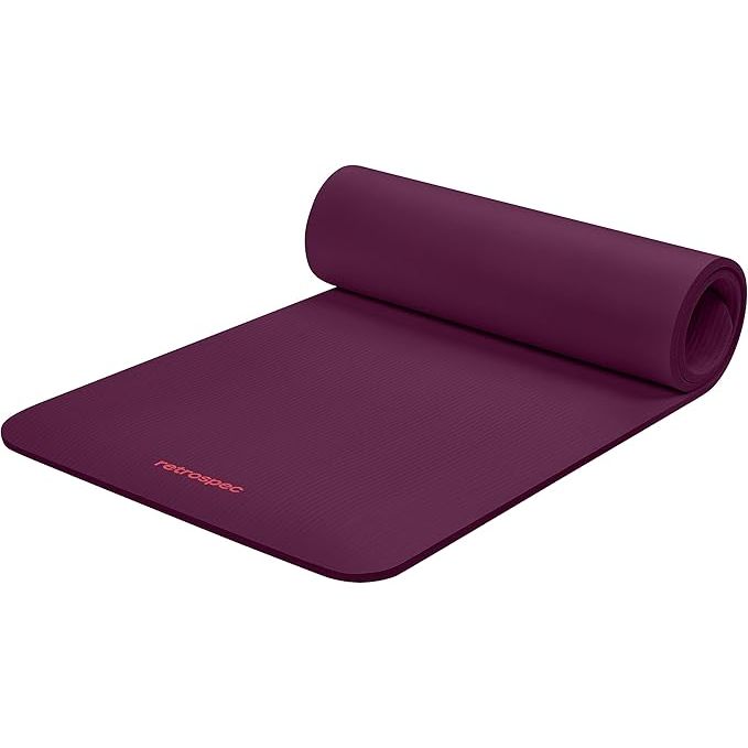 The Retrospec Solana Yoga Mat is a versatile exercise accessory designed for both men and women. It features a thickness of 1/2 inch, providing ample cushioning to support joints during various fitness activities such as yoga, Pilates, stretching, and general floor exercises.