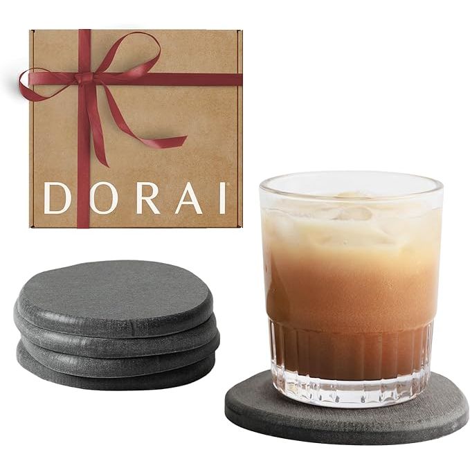 The DORAI Home Stone Coaster Set is a stylish and functional set of 4 stone coasters, made with absorbent diatomaceous earth for quick drying. The round coasters are designed to prevent condensation from cold drinks and protect your surfaces from water rings. The slate stone finish adds a touch of modern elegance to your home decor.