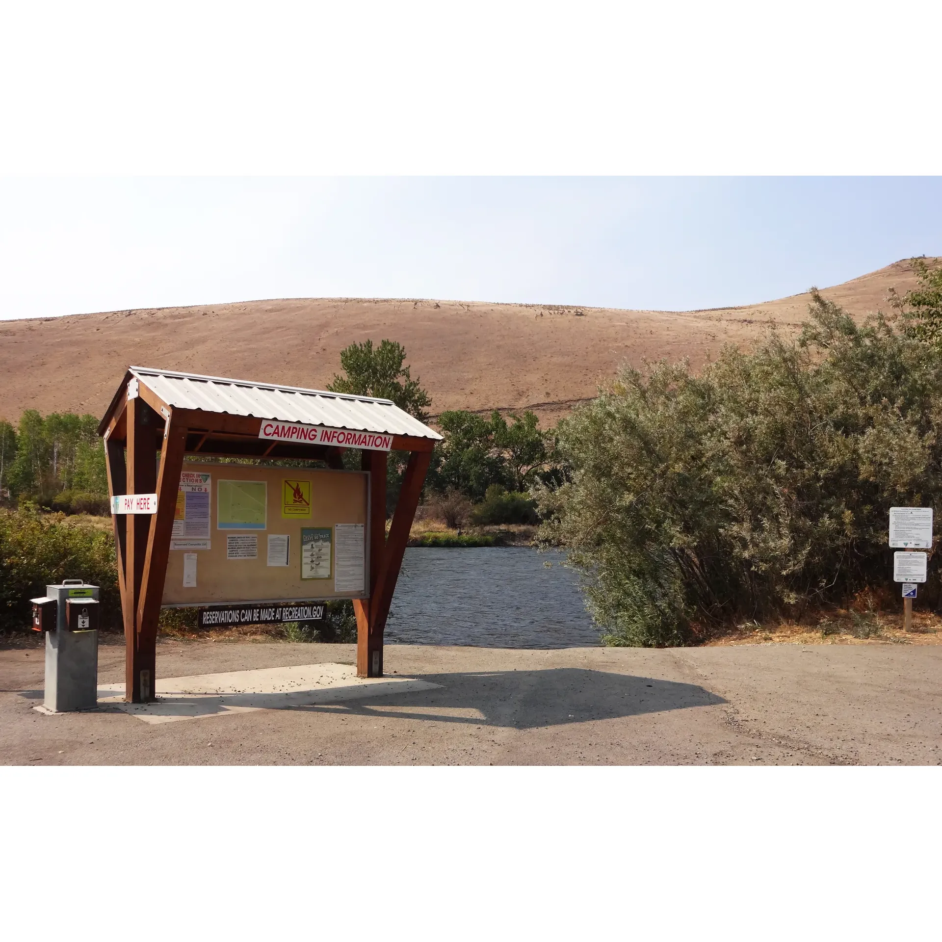 Lmuma Creek Recreation Site is a tranquil haven for outdoor enthusiasts, offering a serene retreat along the banks of the Yakima River. Visitors seeking a picturesque landscape will find the wide, flowing river flanked by the lush lowlands and sun-kissed canyons an unforgettable backdrop for camping and relaxation.

Equipped with a variety of amenities, the site caters to both day-users and campers with its day-use or annual pass system, accepting both America the Beautiful and Golden Age passes. For those who wish to extend their stay, the camping area provides a modest number of well-maintained sites, incorporating both gravel and grassy terrains, with the inclusion of specially paved spots to improve accessibility.

Campers will appreciate the practical features offered, such as vault toilets, fire rings with grates perfect for a cozy campfire meal, and picnic tables to enjoy dining al fresco. The intimate scale of the campground fosters a friendly, community atmosphere where visitors can easily connect with nature and fellow outdoor lovers.

Adventure seekers will delight in the small gravel boat launch, inviting them to set out on river explorations or indulge in fishing. The sweeping views of the Yakima Canyon serve as a dramatic and gorgeous setting for those who appreciate the majesty of nature.

Lmuma Creek Recreation Site boasts a unique charm year-round, providing a mesmerizing setting in the spring and fall, as well as a lively, adventurous spirit during the summer months for those who don't mind embracing the sun's warmth.

For a peaceful escape where nature's beauty is on full display, the Lmuma Creek Recreation Site offers a lovely and idyllic destination to immerse oneself in the great outdoors while enjoying basic comforts and the camaraderie of a tight-knit camping community. Description by ChatGPT.