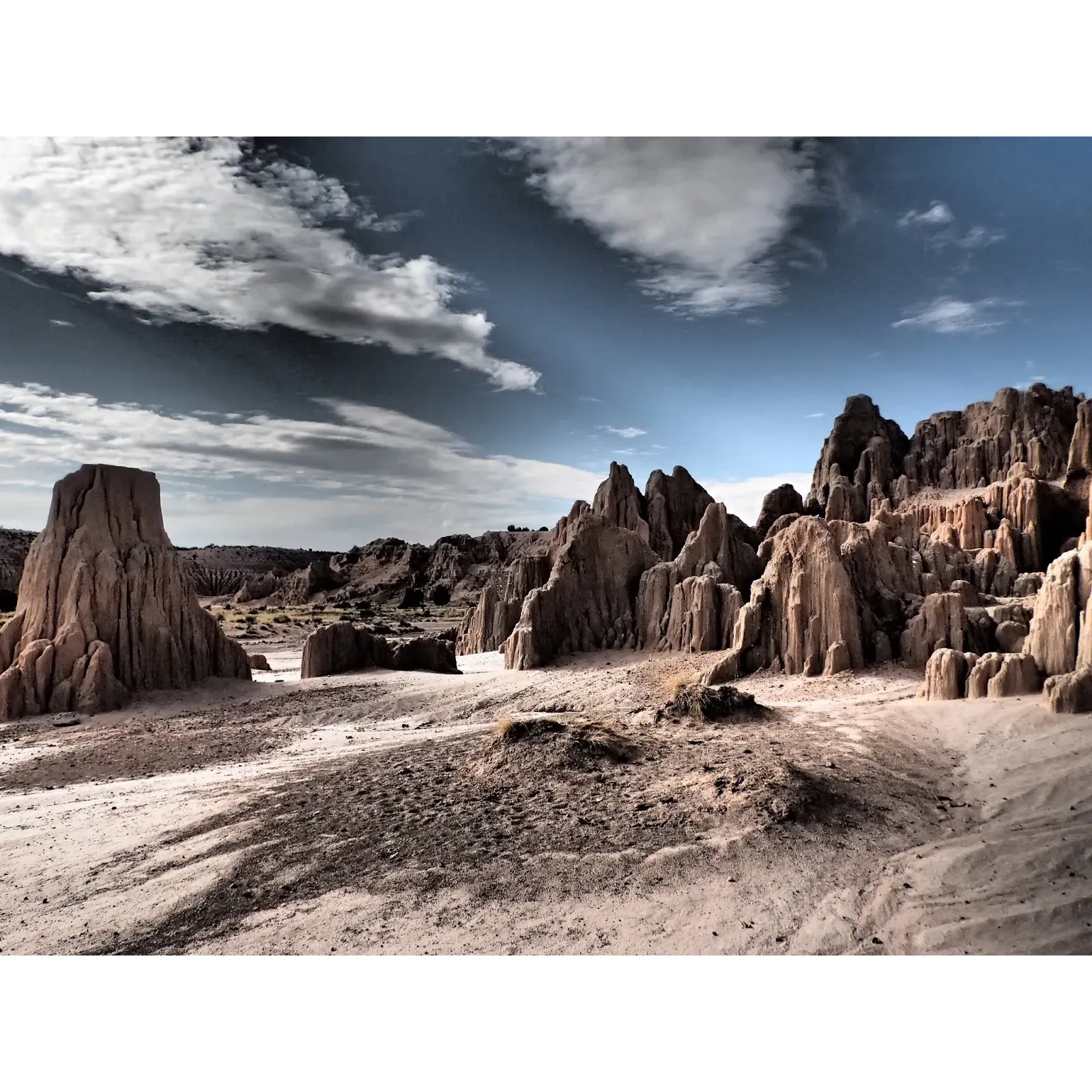 Cathedral Gorge State Park serves as a distinct and memorable experience, whether you're embarking on a day trip or indulging in a leisurely exploration. Its pristine maintenance enhances the serenity of the landscape, ensuring each visit is as remarkable as the formations themselves. Indulge in the serenity, take in the beauty, and create memories that will last a lifetime at this majestic natural playground. Description by ChatGPT.