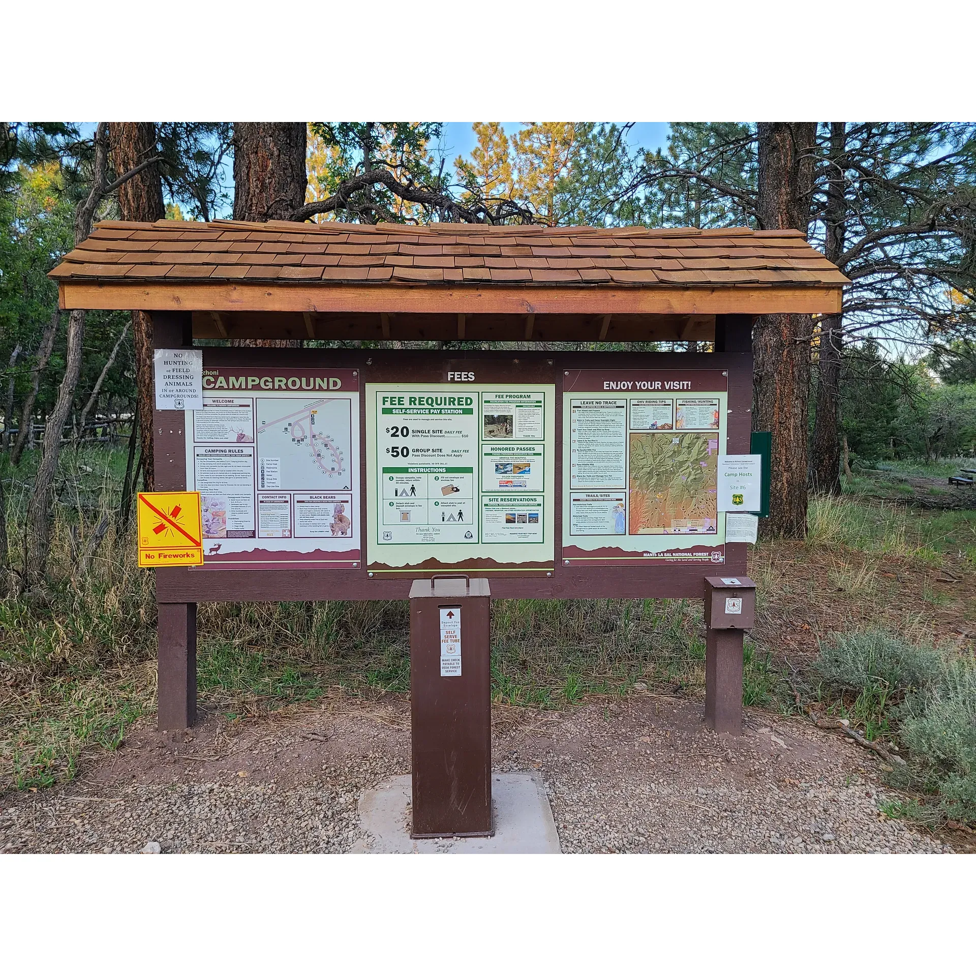 Nizhoni Campground is a prime outdoor destination that offers guests an exceptional nature experience with breathtaking views and well-maintained facilities. Renowned for its magnificent panoramas of the iconic Bears Ears, it has become a beloved spot for hiking, camping, and exploring the great outdoors. The campground is pet-friendly, welcoming nature lovers and their furry companions to enjoy a delightful retreat together.

The meticulous care provided by the camp host ensures clean and sanitary conditions for all visitors, fostering a comfortable and reassuring environment. With restrooms that are regularly cleaned and restocked multiple times a day, and the convenience of running water, Nizhoni Campground prioritizes the comfort and ease of its guests.

These expansive grounds are perfectly equipped to accommodate multiple camp trailers, along with additional space for any outdoor recreational "toys" you might like to bring along. Year after year, families and friends make this their go-to spot, creating lasting memories and forging traditions that are cherished with each return visit.

Visitors looking for a tranquil escape will appreciate the quiet surroundings offered here. With spacious sites available at an incredible value, the campground provides both accessibility and seclusion for a serene camping experience. Those who relish in the ambiance of being surrounded by stately pines will find themselves right at home at Nizhoni Campground.

Among the options, the campground also features two group campsites that set the stage for memorable gatherings and intimate celebrations, such as small wedding ceremonies, in a picturesque setting. Whether searching for a peaceful solo adventure or planning a special occasion amid natural splendor, Nizhoni Campground is an idyllic choice for an unforgettable outdoor experience. Description by ChatGPT.