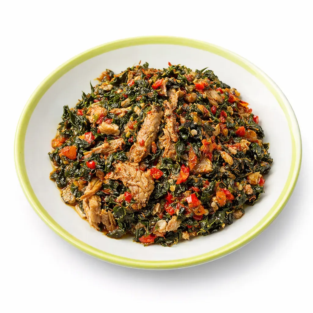 A flavorful Moringa Leaf Sauce from West African cuisine, combining earthy moringa leaves, roasted fish, and spicy peppers, perfect for serving with starchy sides.