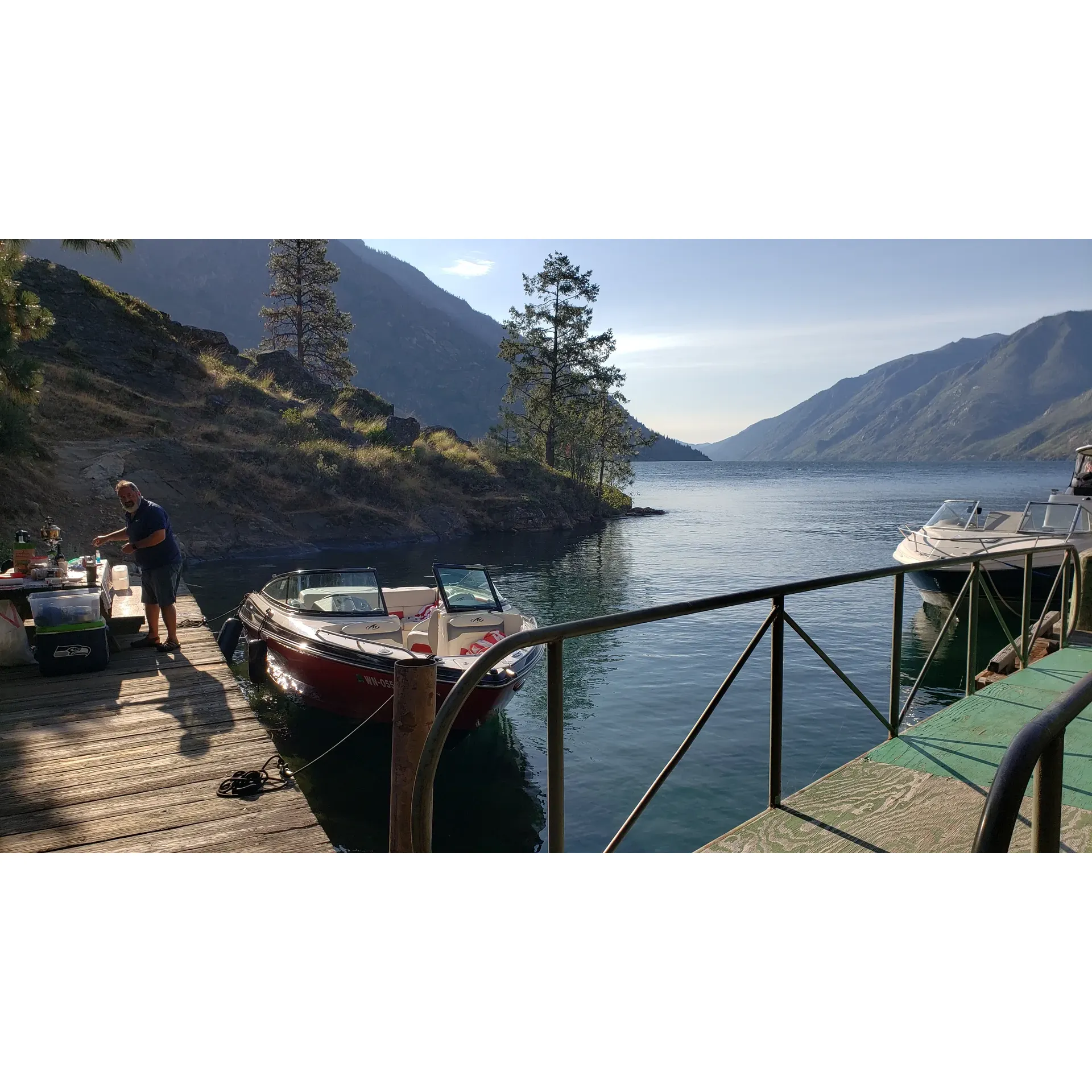 Graham Harbor Boat-In Campground is a standout destination for outdoor enthusiasts looking to savor the sheer beauty of Lake Chelan. Boasting an array of camp and picnic areas, this campground is acclaimed for its panoramic views that stretch both north and south across the lake, providing a picturesque setting for visitors to bask in the tranquility of nature.

With its capacious dock, the site accommodates 4-5 mid-sized boats, ensuring a comfortable space for boating aficionados. The dock's well-maintained condition makes it a reliable and safe point for both docking and embarking on aquatic adventures.

Lauded as one of the top-rated spots for boat camping, Graham Harbor invites you to indulge in superb swimming opportunities. Its crystal-clear waters are perfect for a refreshing dip, while the ample facilities enhance the overall camping experience.

Visitors can find solace in the beautifully constructed shelter, which serves as an ideal spot for gatherings or simply enjoying the company of friends and family. Although the campground features two bathrooms for convenience, guests are encouraged to embrace the rustic charm of nature, as these amenities do not offer running water—a mindful step towards eco-friendliness.

For those with an appreciation for nature's smaller wonders, the campground is a hub for butterflies, adding a touch of liveliness to the serene environment. Whether you are seeking a restful retreat or an active holiday, Graham Harbor Boat-In Campground offers a delightful mix of natural beauty and outdoor recreation, ensuring an unforgettable lakeside getaway. Description by ChatGPT.