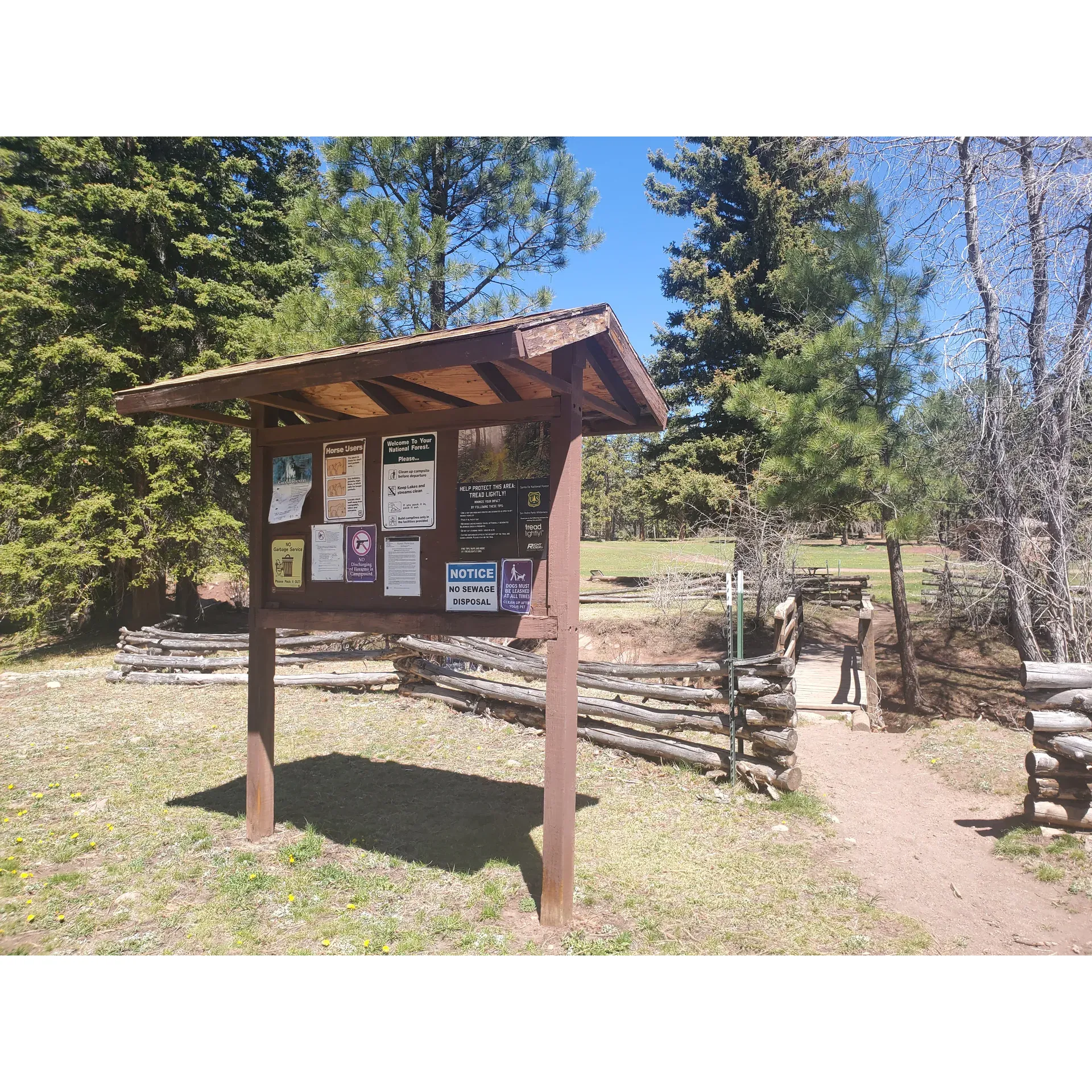 Resumidero Campground, located within the lush expanse of the Santa Fe National Forest and managed by the attentive Coyote Ranger District, is an outdoor enthusiast's haven. The campground offers expansive RV parking facilities to cater to those who bring their home on wheels. Resumidero takes pride in maintaining meticulously clean and well-stocked restrooms, conveniently situated for ease of access from all campsite locations.

Each campsite comes equipped with a picnic table and fire ring, perfect for enjoying meals amidst nature or indulging in the timeless camping tradition of a crackling fire under Stage 1 fire restrictions. Visitors can relish the tranquil atmosphere, often shared with only a handful of other campers, which enhances the sense of privacy and serenity.

While exploring the area, campers will be delighted by the breathtaking waterfall just down the road—an awe-inspiring sight for nature lovers. The campground's setting is a stargazer's paradise, with clear night skies unveiling a spectacular celestial show that should be kept as one of Santa Fe's best-kept secrets.

For those seeking adventure beyond the campsite, the campground serves as a fantastic trailhead into the San Pedro Parks Wilderness. Whether blanketed in winter's snow or bathed in summer's glow, the trails promise an immersive experience in nature's splendor.

While the journey to this secluded escape can be an adventure in itself, the picturesque views along the way are rewarding. Visitors are encouraged to approach with a spirit of adventure and may choose to enter through the locale's less-traveled back entrance.

Resumidero Campground is widely appreciated for its well-kept, peaceful setting. Although temporary closures may occur, nearby alternatives continue to showcase the region's natural charm. The grounds also cater to guests with equine companions or ATVs, reflecting the diverse interests of those who are drawn to the wilderness of Santa Fe. 

Overall, Resumidero Campground is a delightful spot for creating lasting memories, connecting with nature, and experiencing the allure of outdoor adventures amidst the splendor of the Santa Fe National Forest. Description by ChatGPT.