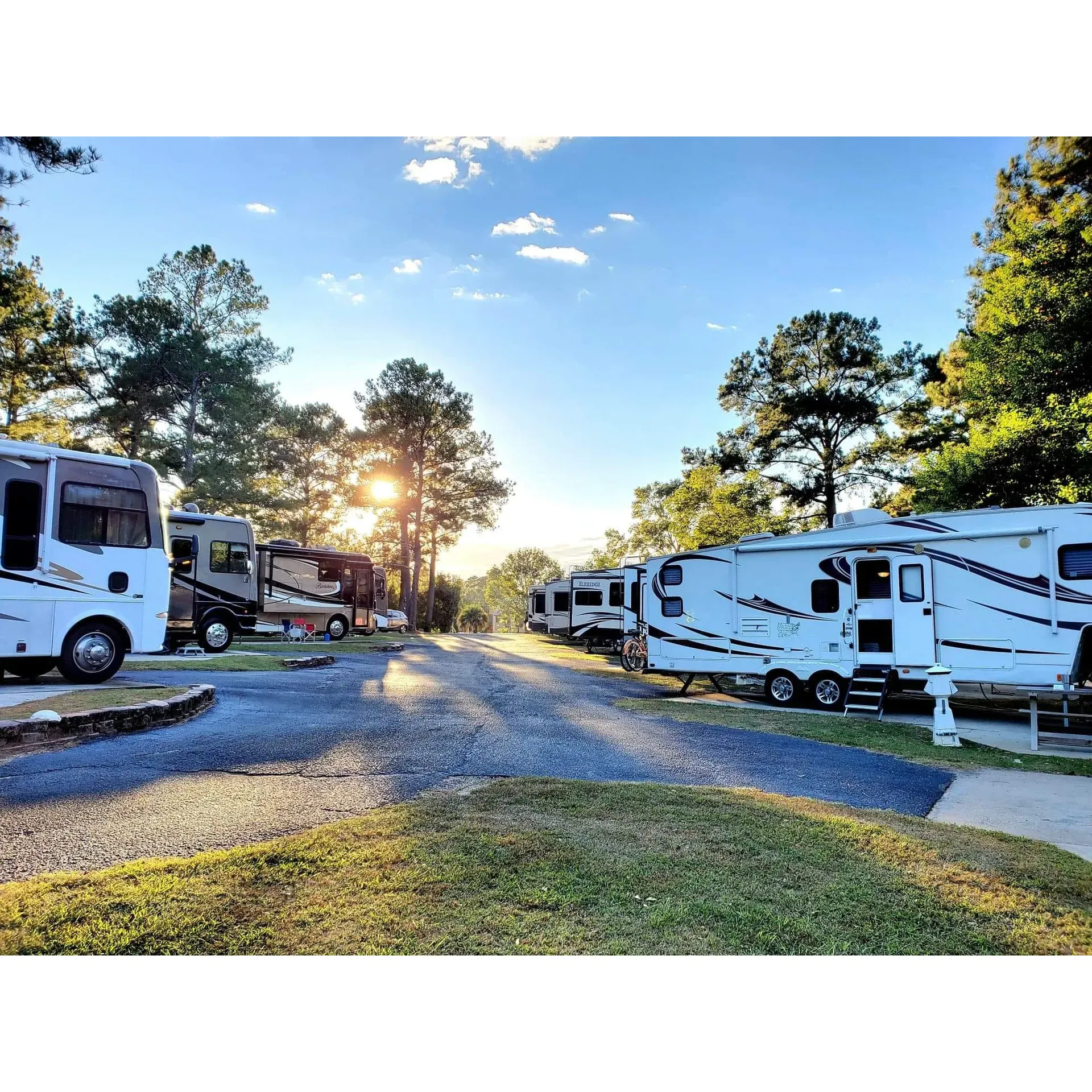 The Ozark/Fort Rucker KOA Journey offers a delightful retreat for travelers looking to unwind amidst the tranquility of nature or seeking a convenient stopover. With its prime location just off the US Hwy, the campground is a haven for those journeying to Florida or exploring the local area. The well-manicured grounds showcase clean and level sites, beautifully shaded by towering pine trees, providing a serene environment for guests.

Visitors can revel in the simple pleasures of a peaceful stroll along the short walking trail surrounding an enchanting pond, which transforms into an illuminated spectacle by night. The campground raises the bar on safety and leisure, boasting a refreshing pool and an inviting playground for younger guests. For those traveling with furry companions, the spacious, well-lit dog park offers plenty of room for play.

Unique to this campground is the preserved tornado/hurricane/bomb shelter from the 60s, an interesting historical feature that also offers peace of mind. Guests are greeted by friendly staff who not only ensure a seamless check-in process but also guide them to their sites.

Accommodations like site 9 promise ample space and privacy, enhancing the sense of relaxation. Personal touches, such as the warm reception by the campground host who waits for late arrivals, exemplify the dedication to guest satisfaction. Travelers can take comfort in knowing assistance is close at hand, even in the face of inclement weather, with a storm shelter conveniently located nearby.

The Ozark/Fort Rucker KOA Journey has earned acclaim for a commitment to excellence, reflected in the impeccable maintenance of its facilities and the genuine hospitality of its staff. It's a highly recommended destination for a stopover or an extended stay, celebrated for its picturesque setting, top-notch amenities, and an unwavering focus on creating a memorable guest experience. Description by ChatGPT.