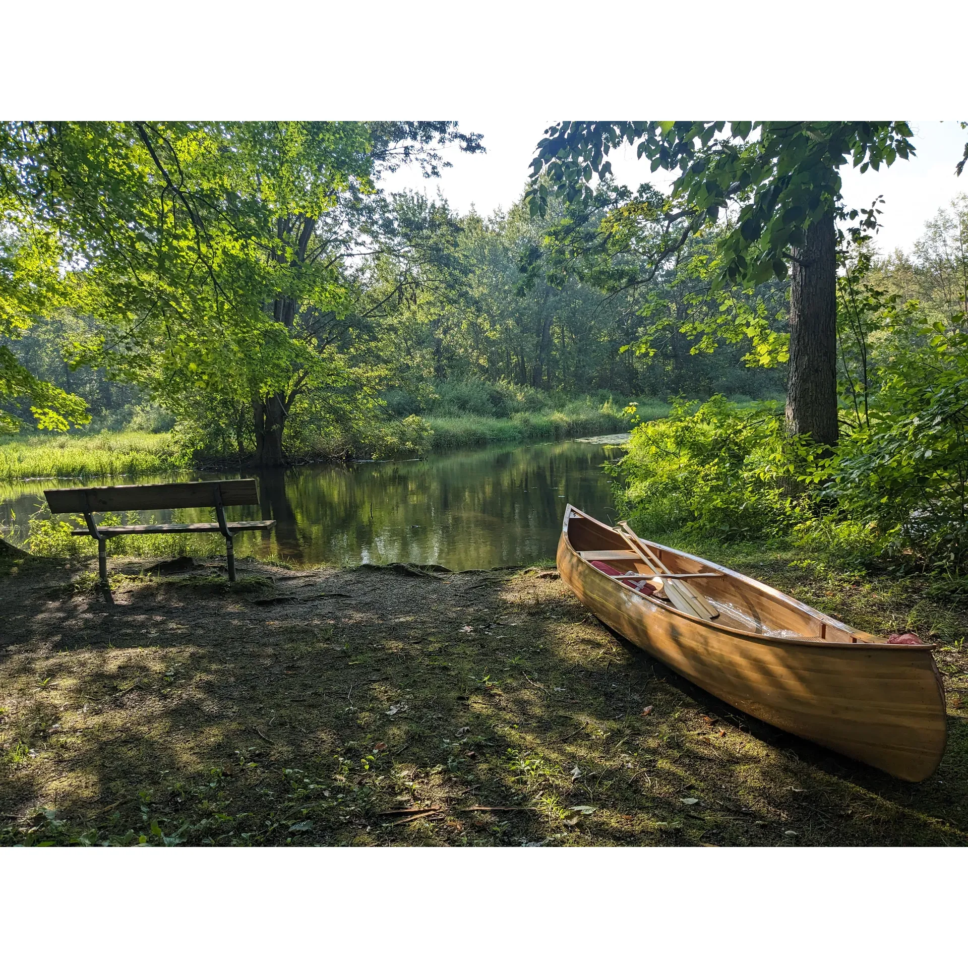 Island Lake-Canoe Campground offers an idyllic escape for those yearning for a serene outdoor experience. With campsite 2 being a spacious terrain, it caters ideally to privacy lovers, larger gatherings, and hammock enthusiasts, promising an intimate connection with nature from the comfort of your zone. Despite the openness to the river, a sense of seclusion is largely maintained, granting guests a tranquil retreat.

Delight in the harmonious blend of leisure and adventure that this unique campground provides. Canoe in to your chosen spot, immersing yourself in the picturesque surroundings. Campsite 1 boasts a delightful swimming area complemented by a floating dock and grassy tent pads, enhancing your stay with recreational activities. Meanwhile, site #2, though lacking in a designated swimming spot, offers a magnificent space for larger groups to bond and relish in the outdoor ambiance.

Embrace the convenience of on-site amenities including fire pits, vault toilets, picnic tables, benches, and strategically placed refuse containers for a hassle-free camping experience. The additional touches of hand sanitizer and toilet paper are thoughtfully provided to ensure comfort during your wilderness adventure.

Ready your canoe for an invigorating journey to this charming campground, where the wonders of nature await. Spend sun-soaked afternoons floating down the gentle river currents and let the sounds of nature soothe your soul. Keep your eyes peeled for the astonishing wildlife, from the extraordinary spectacle of a snapping turtle duel to the daily routines of the local fauna.

Island Lake-Canoe Campground invites you to forge unforgettable memories, whether basking in the sun, witnessing the strength of mighty turtles, or simply enjoying the peaceful atmosphere. As you settle in, the surrounding wilderness becomes a natural playground, a place to bond, and a tranquil haven, all the while respecting the beauty of the environment for future guests to cherish. Description by ChatGPT.