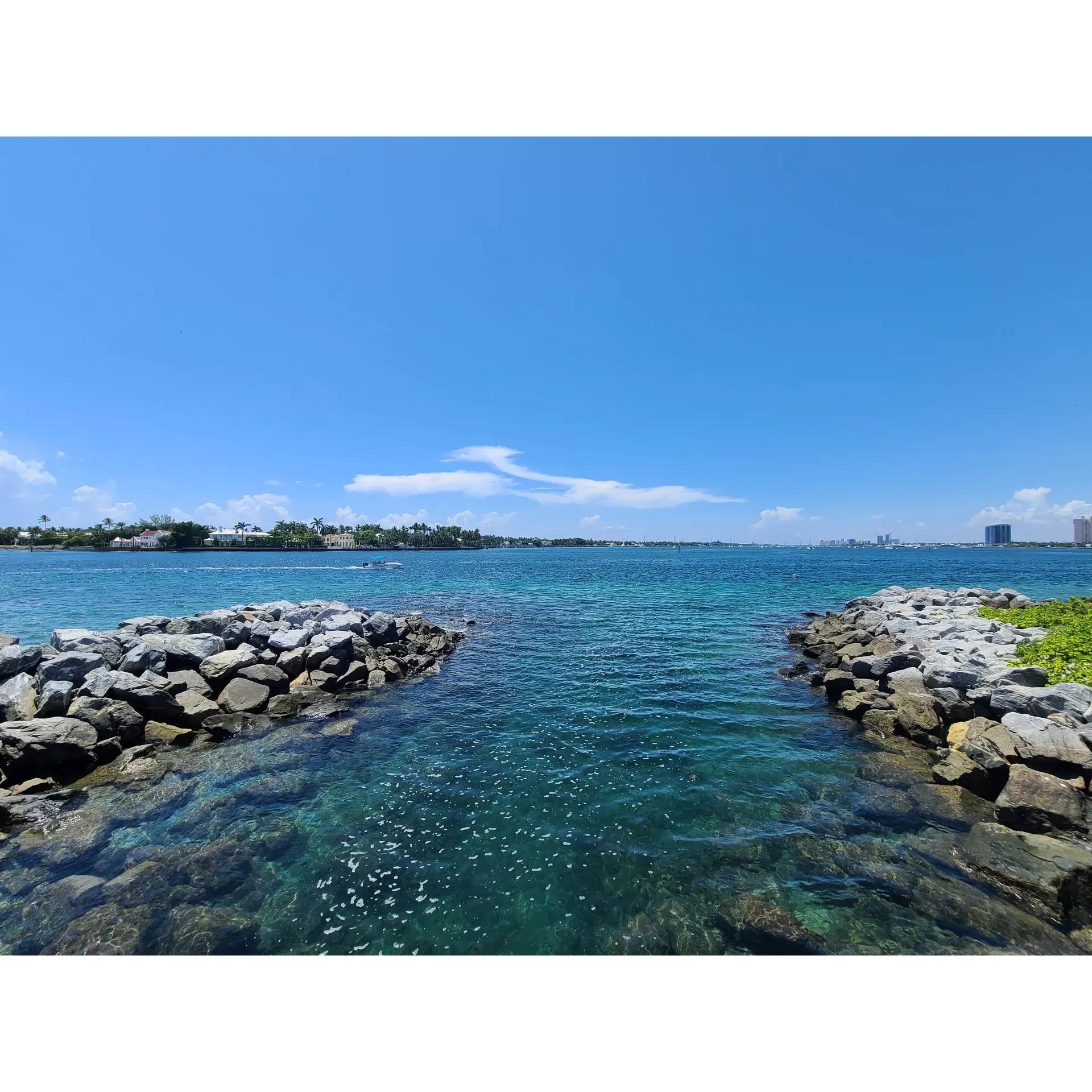 Peanut Island Park offers a serene and picturesque escape within Florida's Intracoastal Waterway, presenting a delightful oasis for visitors seeking a day of relaxation, adventure, and natural beauty. Boasting soft, pristine sands free from seaweed, the island invites guests to unwind under the radiant sun and immerse themselves in the soothing ambiance of turquoise blues that create a paradise-like setting.

A popular spot for early risers, the park draws visitors to its shores via a convenient ferry service. Adventurers can also arrive by personal watercraft, such as boats or jet skis, adding an exhilarating prelude to their island retreat. Adorned with well-maintained amenities, including clean restrooms, the park prioritizes comfort for all its guests.

Families and nature enthusiasts indulge in the park's diverse offerings, from sunbathing to snorkeling in the crystal-clear waters, uncovering a mesmerizing underwater world. The island's welcoming policy for canine companions ensures that even furry family members can partake in the day's excursions.

For those seeking an extended stay, the island provides camping opportunities, allowing visitors to bask in the tranquility of a starlit sky. While there are no concession stands, this seclusion is a boon for picnickers prepared with their own provisions, offering a chance to enjoy a private feast amidst nature's splendor.

Peanut Island Park is also conducive to moments of relaxation and disconnection from the hustle and bustle of daily life. With the absence of alcohol, the atmosphere remains family-friendly and peaceful, guaranteeing an enjoyable experience for those seeking respite.

Ideal for weekdays to avoid the lively crowds, the park's allure is evident in its capacity to fill quickly, a testament to its charm and desirability. Whether for quiet contemplation or spirited exploration, the island's magical essence beckons all who seek a slice of paradise, a hidden gem within the Palm Beach area, simply waiting to be discovered and cherished. Description by ChatGPT.