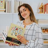 Abbie Emmons is a content creator and writing coach who teaches writers how to make their stories matter by harnessing the power and psychology of storytelling. Her YouTube channel features advice on brainstorming story ideas, character development, and the writing process, with new videos released every Wednesday.