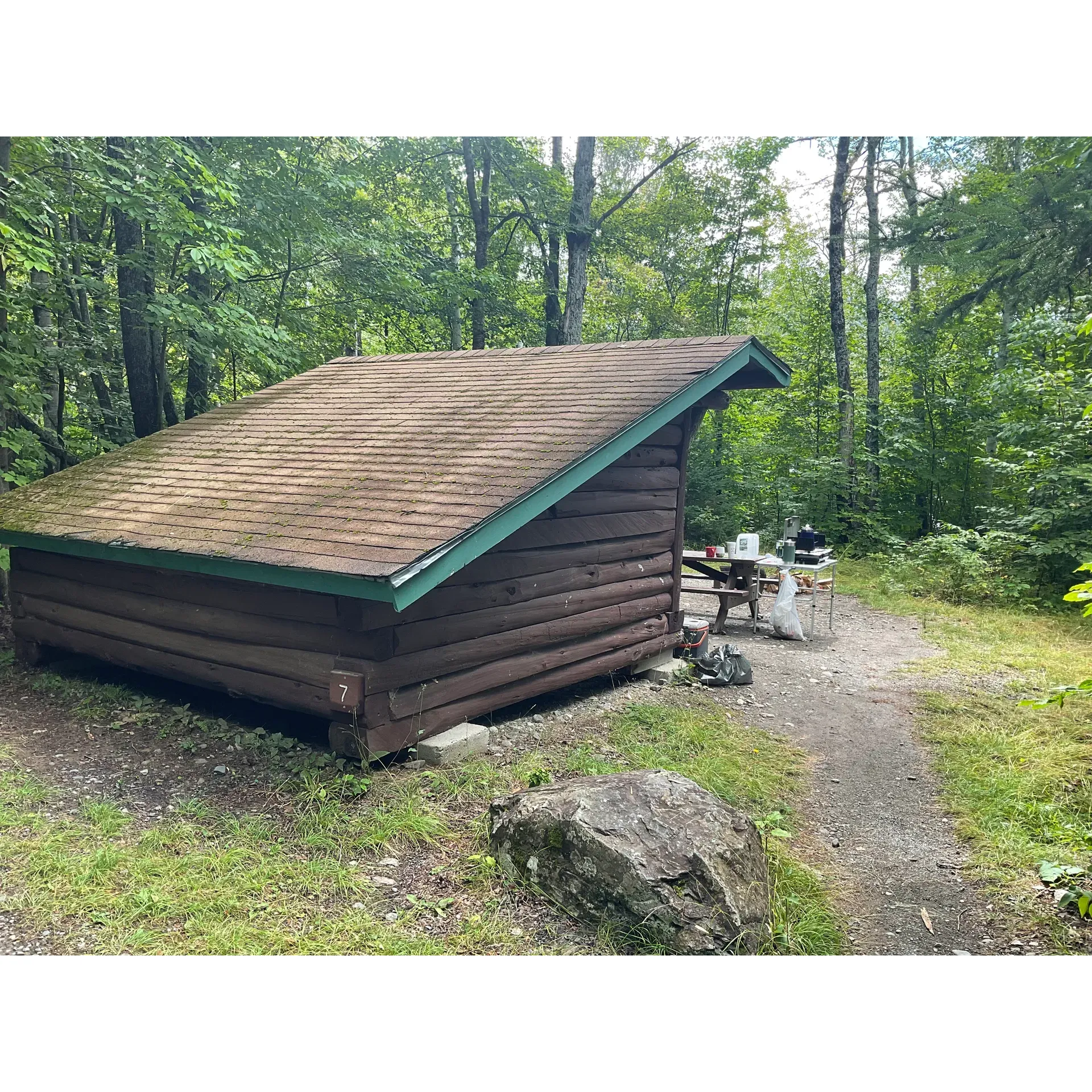 South Branch Pond Campground offers a serene and picturesque retreat perfectly positioned within Baxter State Park, allowing for an immersive outdoor experience. This campground serves as an idyllic base for nature lovers, with a selection of tent sites, lean-tos, and cozy cabins available to enhance your stay in the wilderness. The Rangers eagerly provide guests with helpful information and ensure a warm welcome to everyone.

A stay at this enclave promises adventure and solitude in equal measure, with canoe rentals offering tranquil moments on the reflective pond waters. Surrounding the campground is a bounty of hiking trails, suitable for all capabilities, from gentle walks to challenging treks, including the acclaimed Traveler loop and Black Cat loop, where one can marvel at the glory of ancient volcanic landscapes and panoramic vistas.

South Branch Pond Campground values the essence of rustic camping, celebrating the simplicity of car camping without the intrusion of modern utilities, which inspires a genuine connection with the environment. Despite the absence of electricity and running water, the pristine lake offers an excellent source for filtered drinking water.

The campground boasts clean and well-maintained facilities, ensuring a comfortable stay amidst the beauty of nature. Fire rings are provided at each site, with firewood conveniently on sale, promising cozy evenings under the stars. Strict quiet hours are observed, creating an atmosphere of peace and tranquility where the only sounds are those of the wilderness.

For enthusiasts eager to delve into the natural beauty of Baxter, this haven delivers an unparalleled opportunity to fish, hike, swim, and paddle in an environment that is both secluded and awe-inspiring. Embrace the wilderness at South Branch Pond Campground, where the simple joys of outdoor living are celebrated and cherished. Description by ChatGPT.