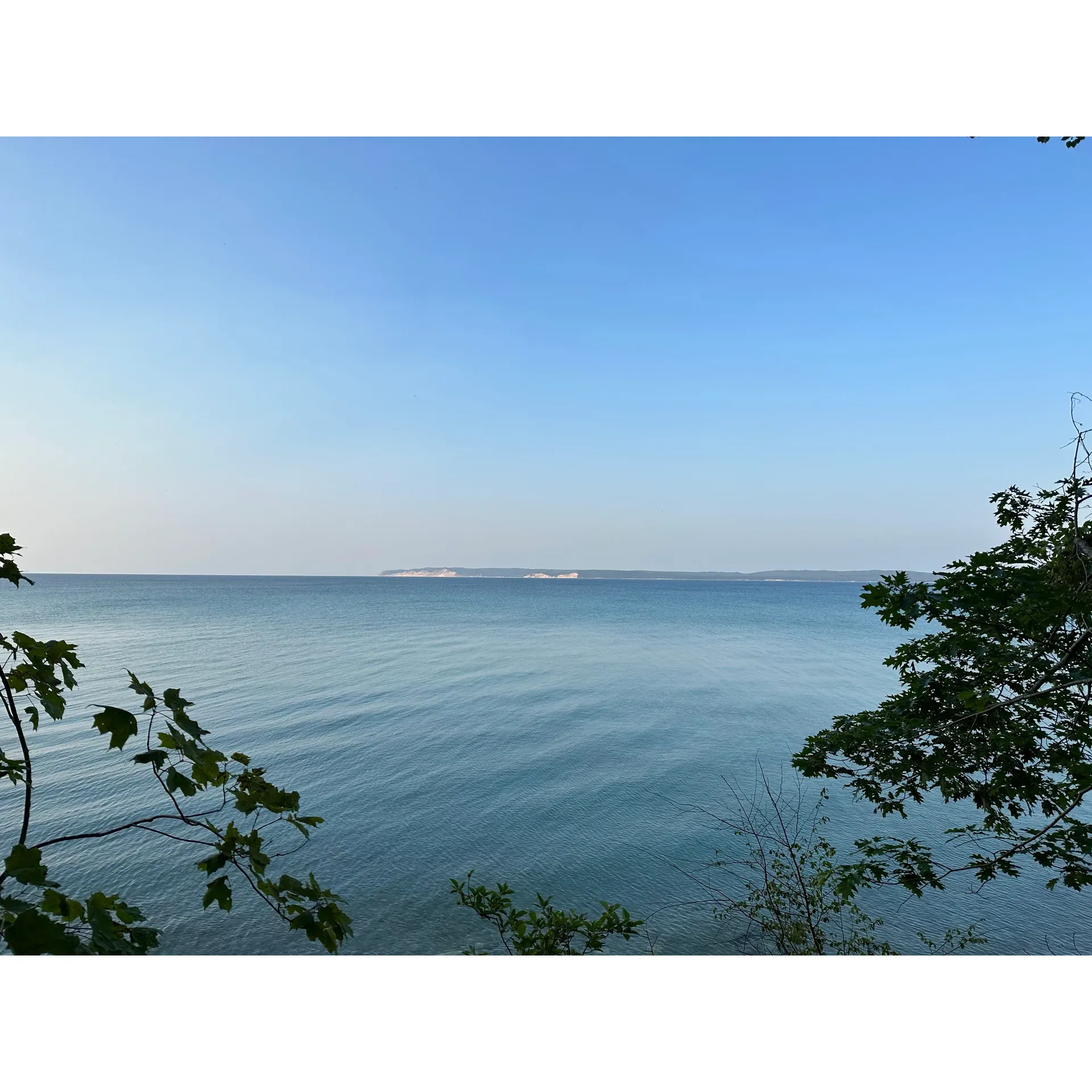 Popple Campground on South Manitou Island beckons adventurers seeking a tranquil retreat into the wilderness. With its remarkable isolation, this destination rewards visitors with an immersive experience in nature's splendor, free from the distractions of modern conveniences. Embrace the serenity and simplicity of life outdoors while you hike the scenic 3.7 miles carrying your gear to find your temporary home amongst the elements.

Featuring stunning lakefront views that can best be enjoyed from the prime location of site number 3, perched on a cliff overlooking the expansive Lake Michigan, campers are treated to a backdrop of awe-inspiring vistas that make every step of the journey worthwhile. Facilities maintain a rustic charm with the provision of a small pit toilet, ensuring basic needs are met while allowing the natural surroundings to take center stage.

With its location on South Manitou Island, Popple Campground offers an experience defined by the joys of backpack camping. Those who venture here delight in the seclusion and reduced foot traffic, which also means encounters with mosquitoes are kept to a minimum, allowing for peaceful enjoyment of the great outdoors. While preparation is key – including bringing filtration straws for drinking and packing protective clothing for the occasional brush with poison ivy – the payoff is a unique camping experience sure to foster unforgettable memories.

In summary, Popple Campground is a gem for those who revel in the challenge of self-sufficiency and find joy in the quiet company of nature. Its secluded sites promise an extraordinary setting where campers can disconnect, explore, and enjoy the pristine beauty of one of Michigan's remarkable natural landscapes. Description by ChatGPT.