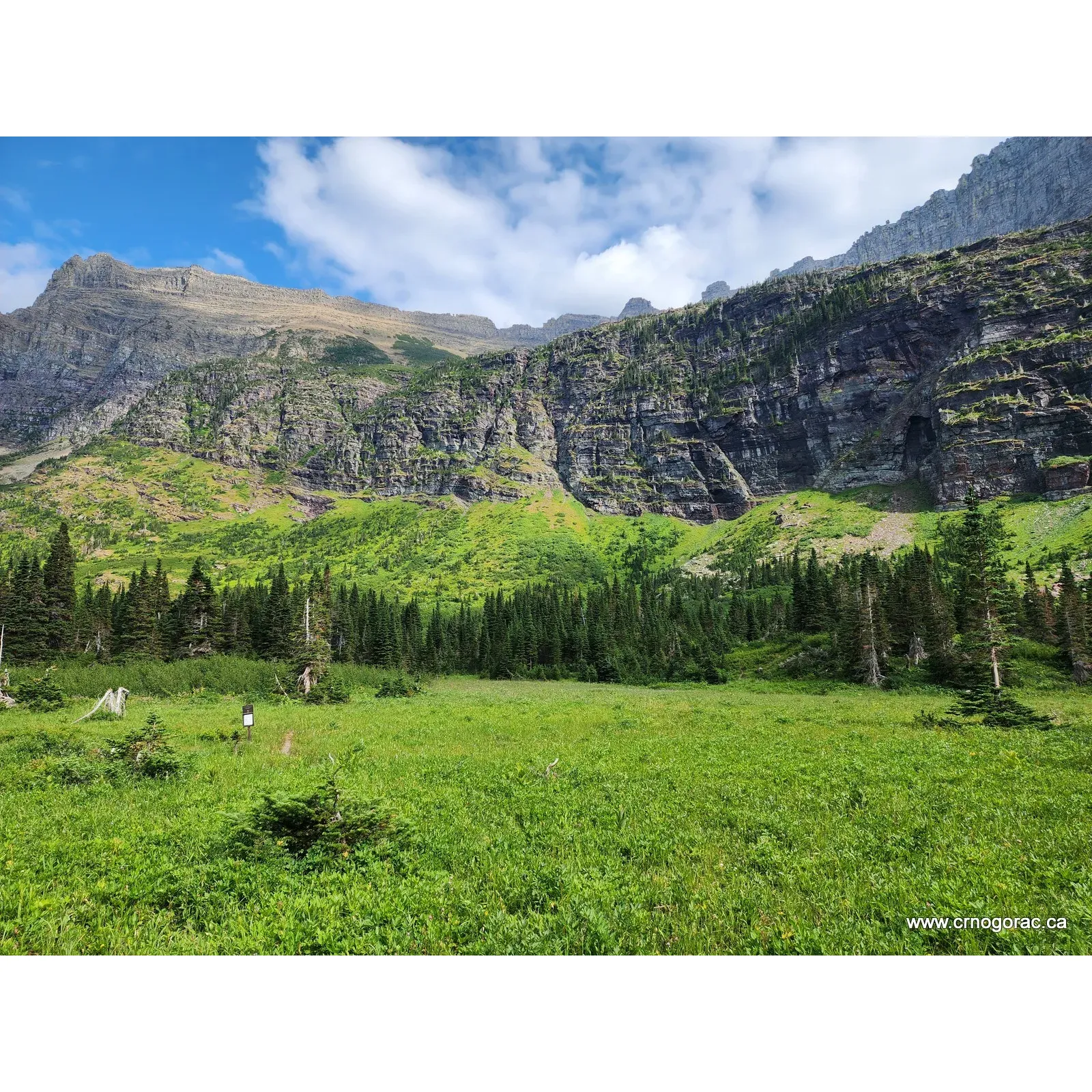 Helen Lake Campground is a true hidden gem for the adventurous camper looking for a serene escape into the great outdoors. Set in a breathtaking environment, this secluded campground offers a unique chance to immerse oneself in the pristine beauty of a landscape sculpted by ancient glacial activity. With the majestic backdrop of a glacier, the open setting of the campground allows for uninterrupted panoramic views of the sky and landscape, perfect for stargazing and wildlife observation.

Although modest with just two campsites, the campground provides a peaceful and intimate experience for visitors. A rustic charm defines Helen Lake Campground, with a simple yet functional makeshift bridge providing access across the outflow of Helen Lake, adding to the site's sense of adventure without the need to ford the waters.

Trails leading in and around the campground have a rugged, untouched character that highlights the natural beauty of the area. Campers who appreciate a genuine backcountry feel will find the slightly wild state of these paths adds to the allure of their hiking experience.

Helen Lake Campground is an ideal spot for those seeking solitude and a connection to nature in its pure state. Its remote location at the end of a dead-end valley ensures that it remains a tranquil retreat. Here, the spirit of outdoor adventure thrives, offering a restful yet invigorating stay for those who venture to this off-the-beaten-path destination. Description by ChatGPT.