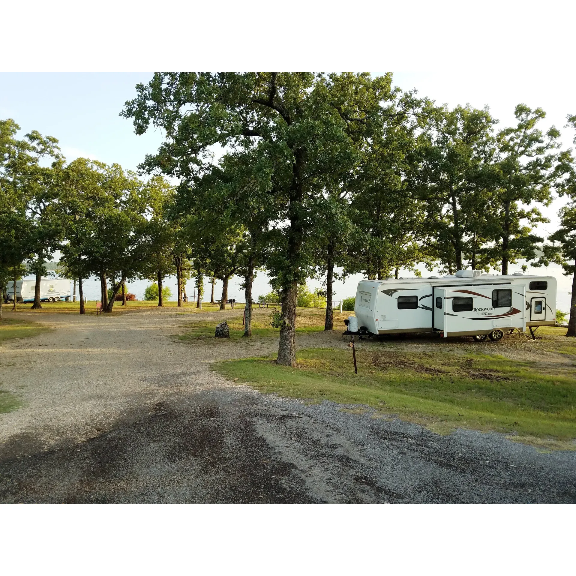 Pat Mayse East Campground offers a tranquil and delightful escape for outdoor enthusiasts and equestrian lovers alike. It is particularly known for its attentive hosts who enrich the camping experience with their knowledge and helpfulness, ensuring visitors feel welcomed and well-informed during their stay.

Cleanliness and convenience are given attention here, as evidenced by the impeccable maintenance of the vault toilet facilities, which are well-equipped with lighting - an amenity that goes beyond what is typically expected in such rustic settings. Additionally, water and electric hookups are readily available, though not necessarily adjacent to every site, ensuring a comfortable stay for campers with RVs and trailers.

Equestrian campers are well catered to with spacious, longer sites specifically designed to accommodate both the riders and their horses. The provided fencing is generous enough for horses to move freely without needing to be confined to trailers, enhancing the overall outdoor experience. The equestrian beach, a distinctive feature, offers a unique spot for horses to enjoy a refreshing dip alongside their owners.

The campground boasts two distinct swimming areas tailored to suit everyone's needs - one for people and another specifically for horses, ensuring a safe and enjoyable swimming experience for all guests. The campground also offers access to a boat ramp with ample parking, making it a convenient launch point for boating enthusiasts.

Recreation opportunities are abundant with excellent fishing spots where enthusiasts can catch a variety of sport fish, including largemouth bass, white crappie, sunfish, striped bass, and catfish. Additionally, there are nature trails perfect for both hiking and horseback riding, though they offer a wild and authentic feel as they may be in their natural state, providing a more adventurous trail-riding experience.

Set amidst the serene landscape, the campground is relatively quieter and more relaxed compared to others in the region, making it an ideal location for visitors seeking a peaceful outdoor retreat. Wildlife sightings are common, adding a touch of wilderness to the camping experience.

Overall, Pat Mayse East Campground is a haven for those looking to immerse themselves in nature, enjoy a variety of outdoor activities, or simply find a peaceful spot to unwind with the allure of lakeside relaxation, equestrian-friendly amenities, and the charm of local wildlife. Description by ChatGPT.